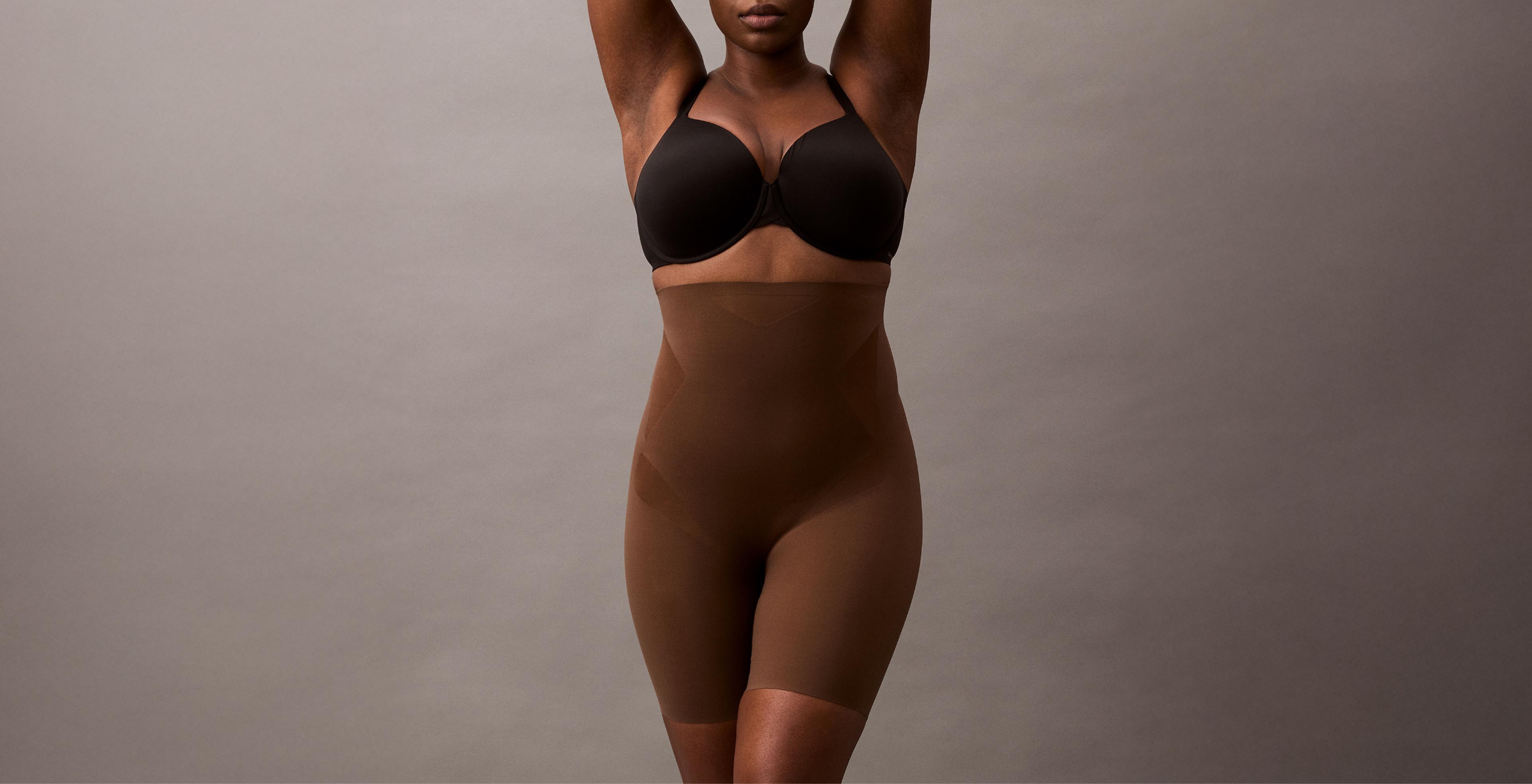 Model posing in Stay-Put Stretch Shapewear