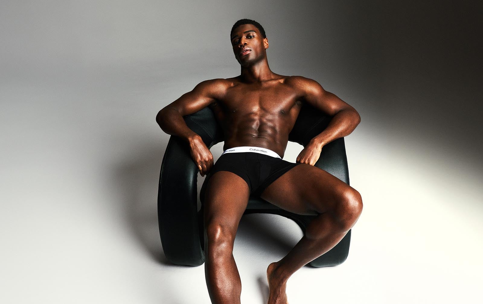 Model posing with Calvin Klein trunks.