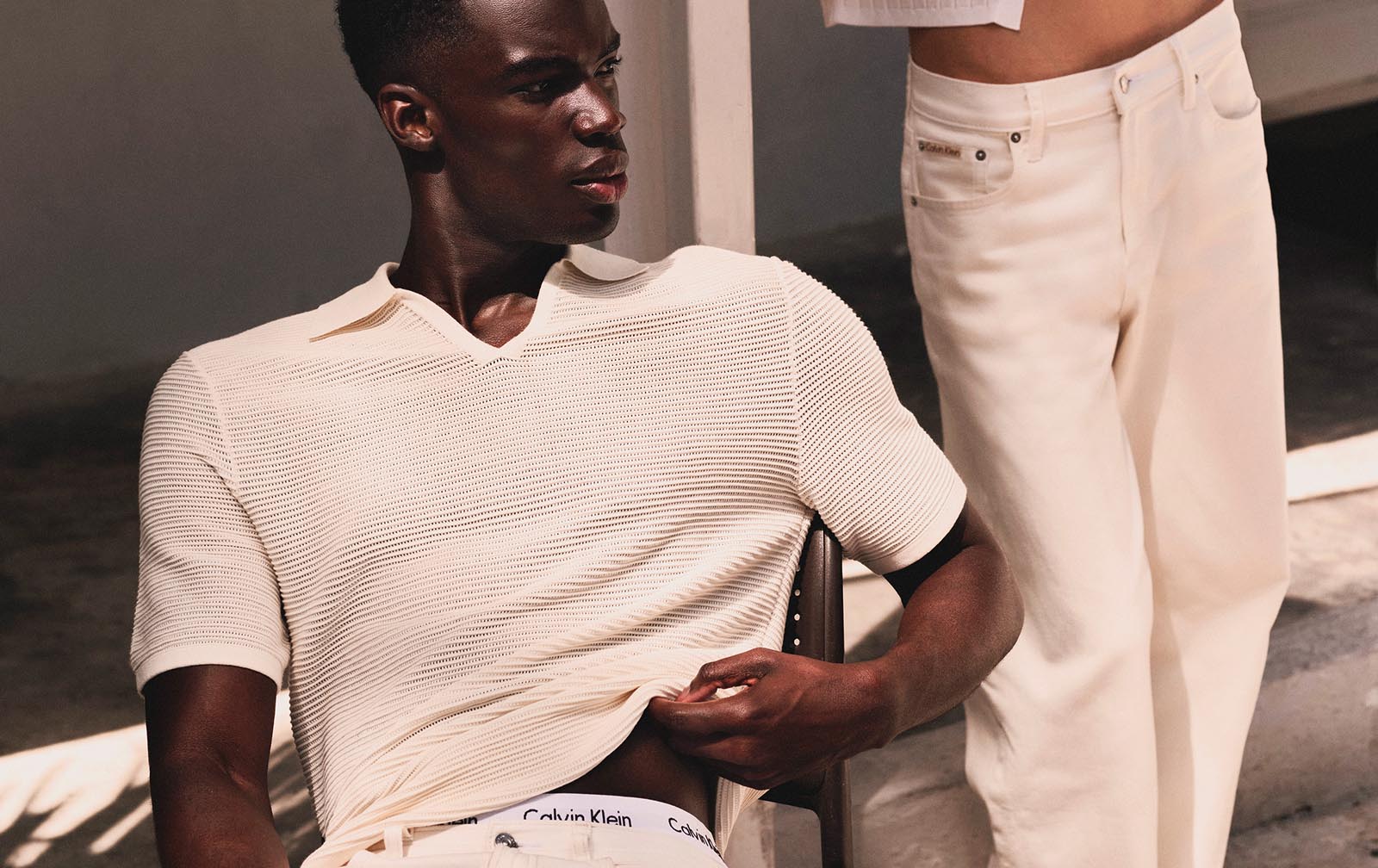 Model posing in Calvin Klein apparel.