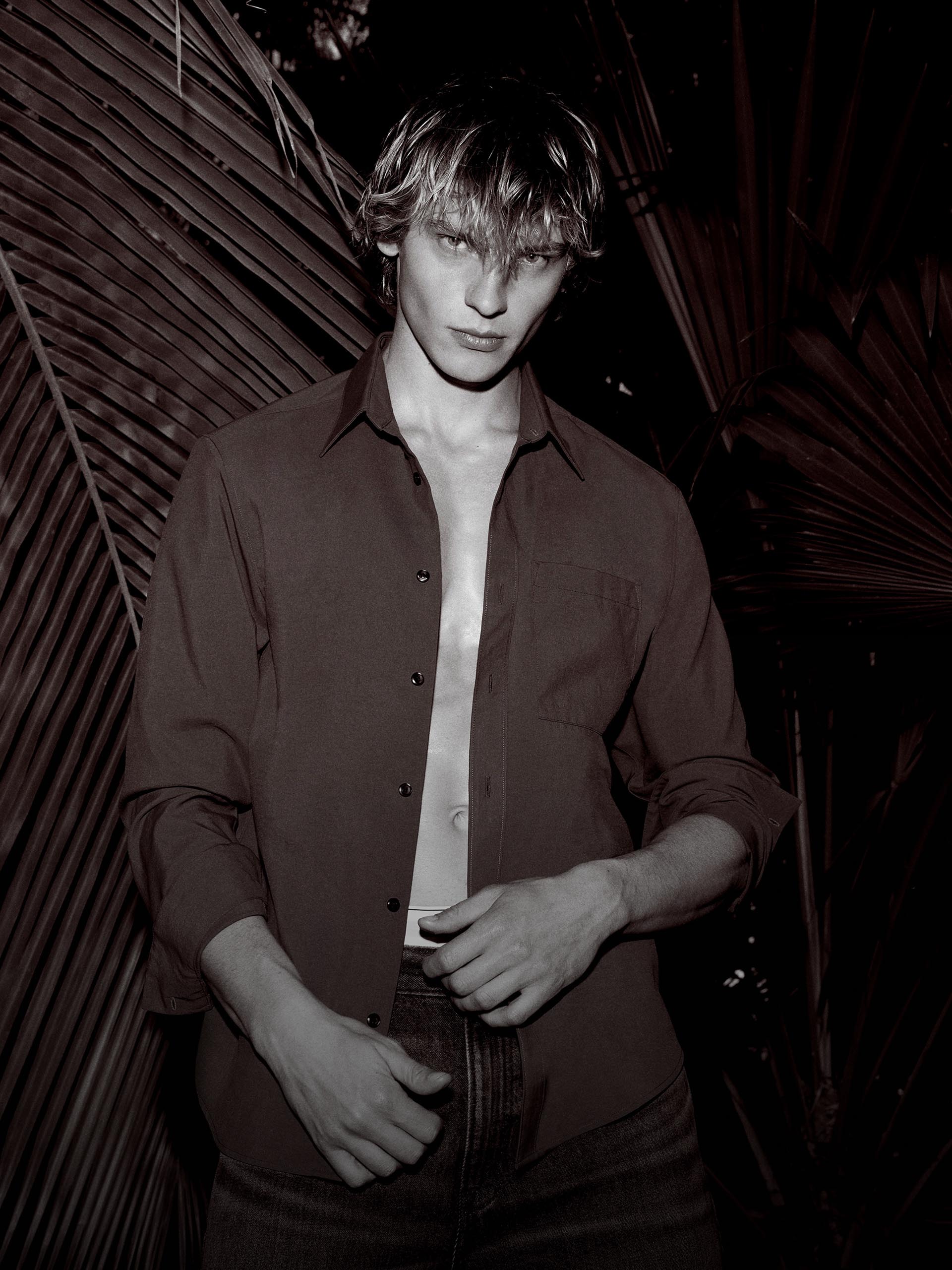 Model wearing a black semi-formal button-down during a night out.