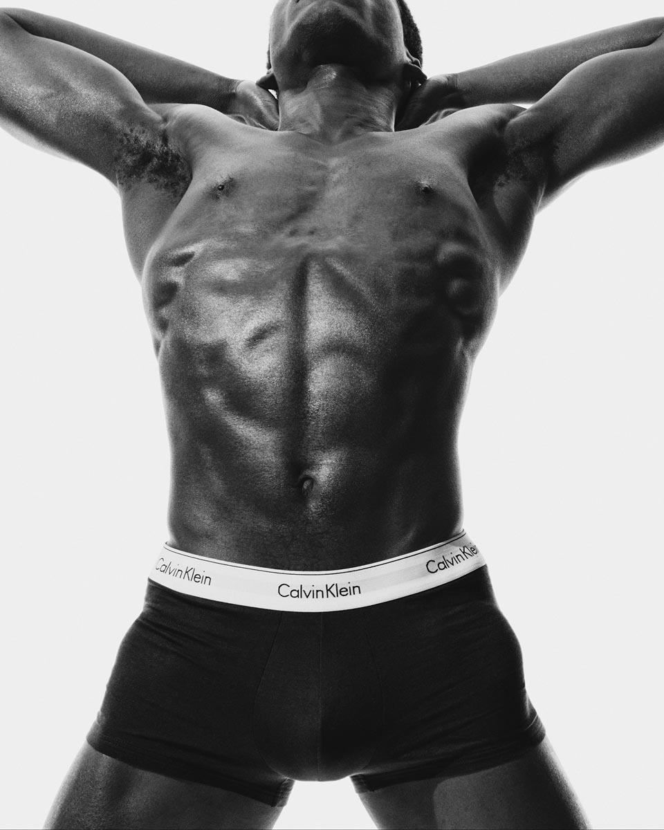 Model posing in white boxer briefs