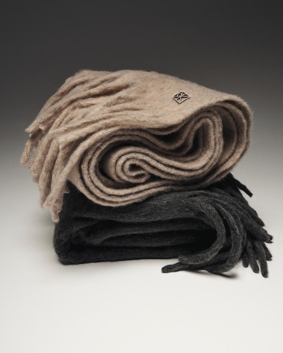 Still life image of a cream scarf