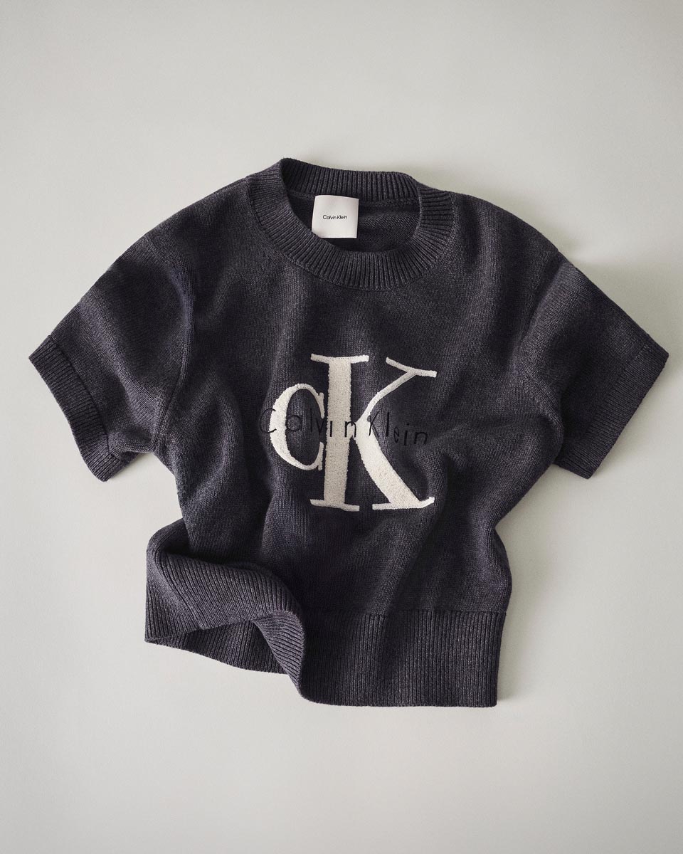 Still life image of a grey CK logo sweater