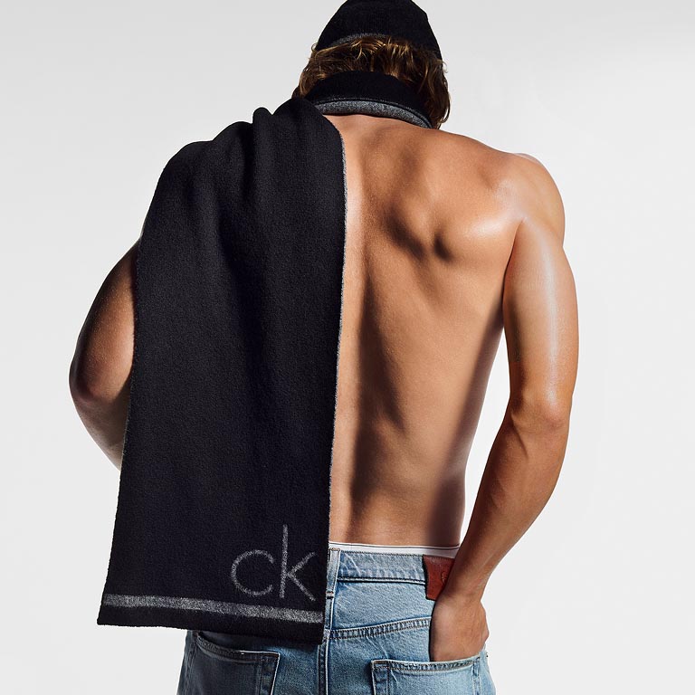 Model posing in a black scarf