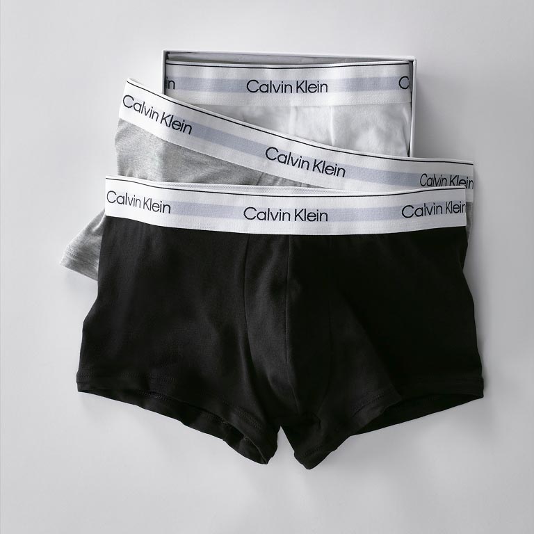 Model posing in a red bra and panties