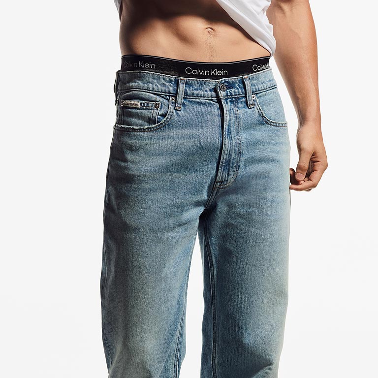 Model posing in light blue Calvin Klein denim