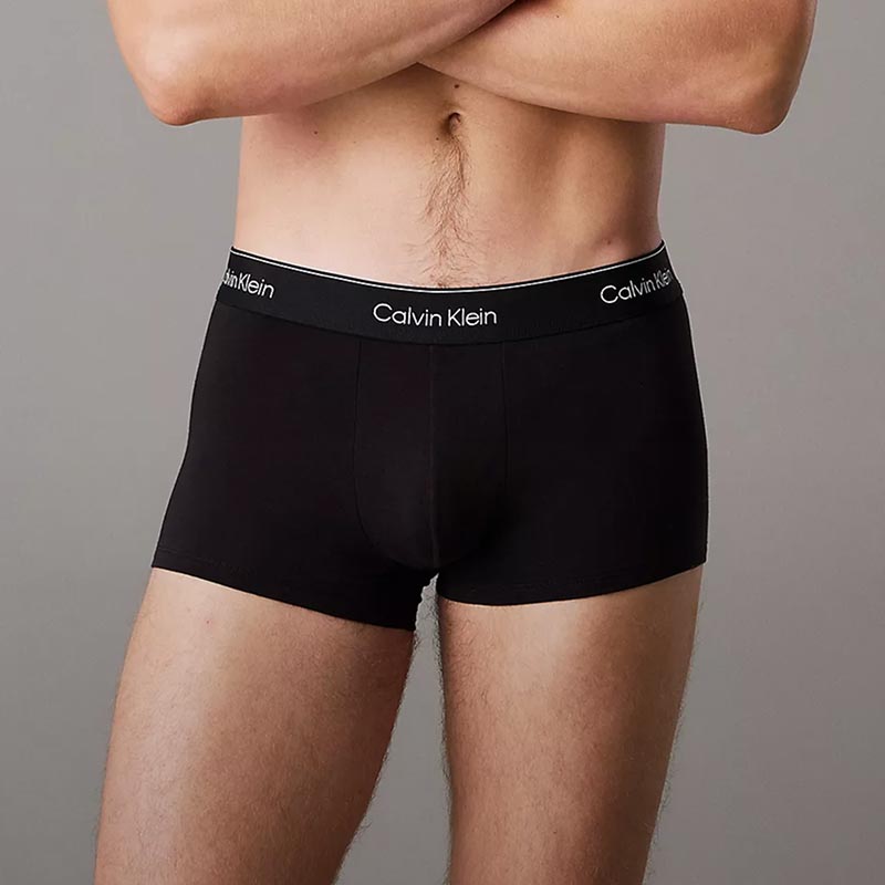Model posing in black trunk underwear