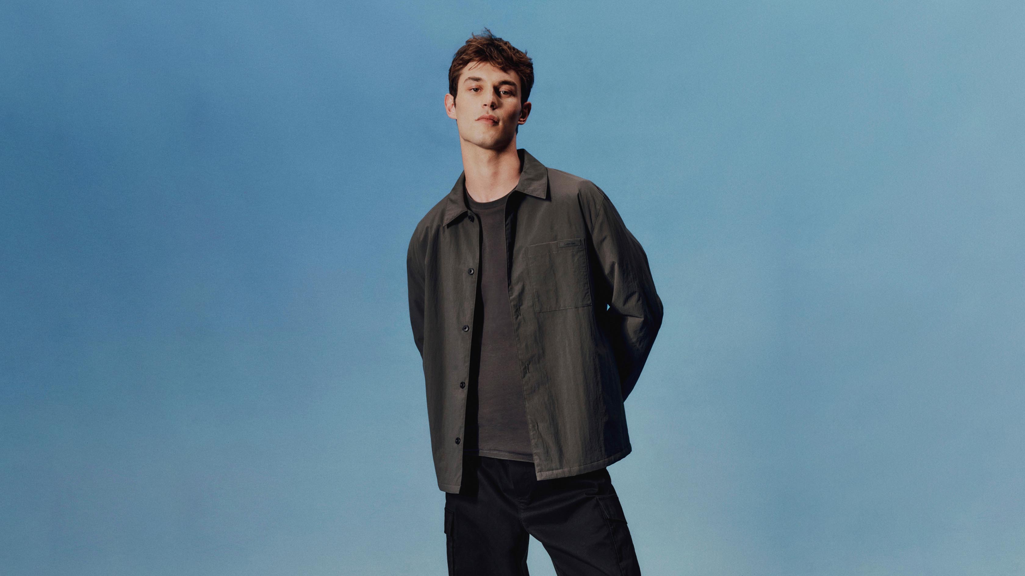 Model posing in a nylon jacket