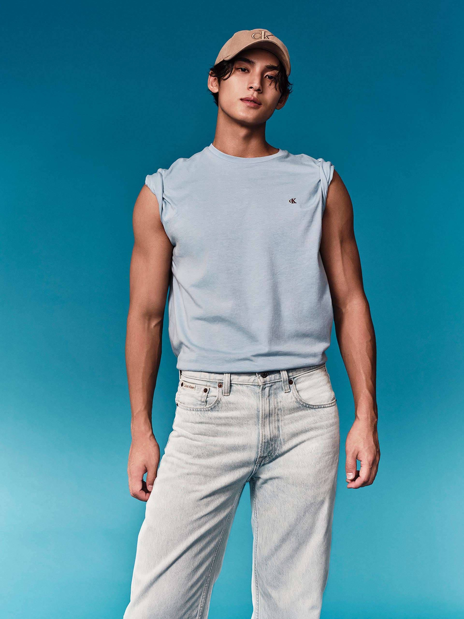 Mingyu wearing a t-shirt with rolled up sleeves