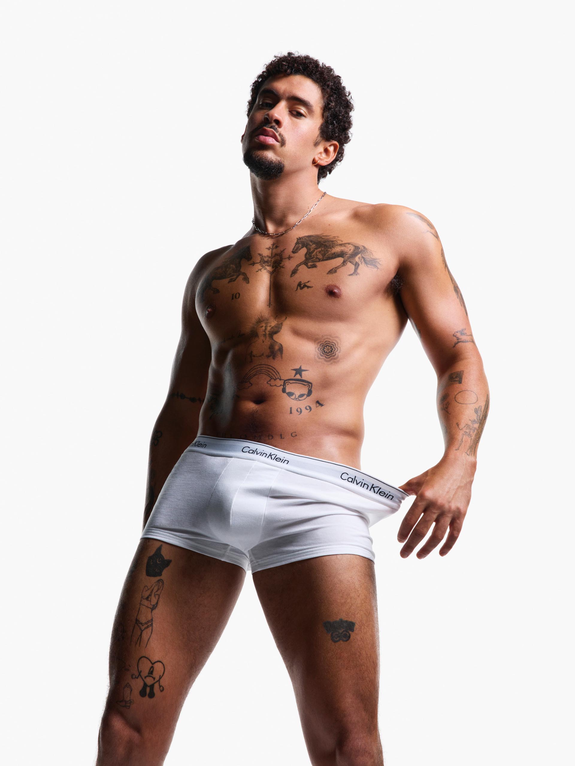 Bad Bunny posing in Calvin Klein Underwear 
