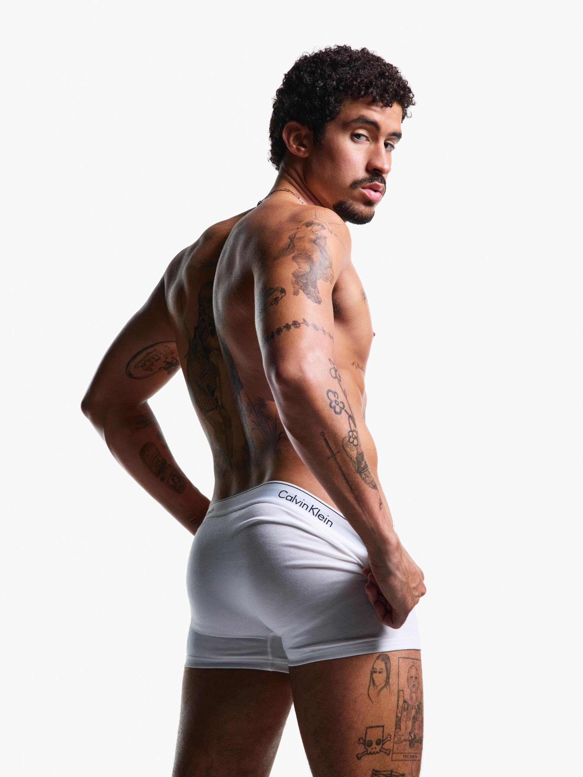 Bad Bunny posing in Calvin Klein Underwear 