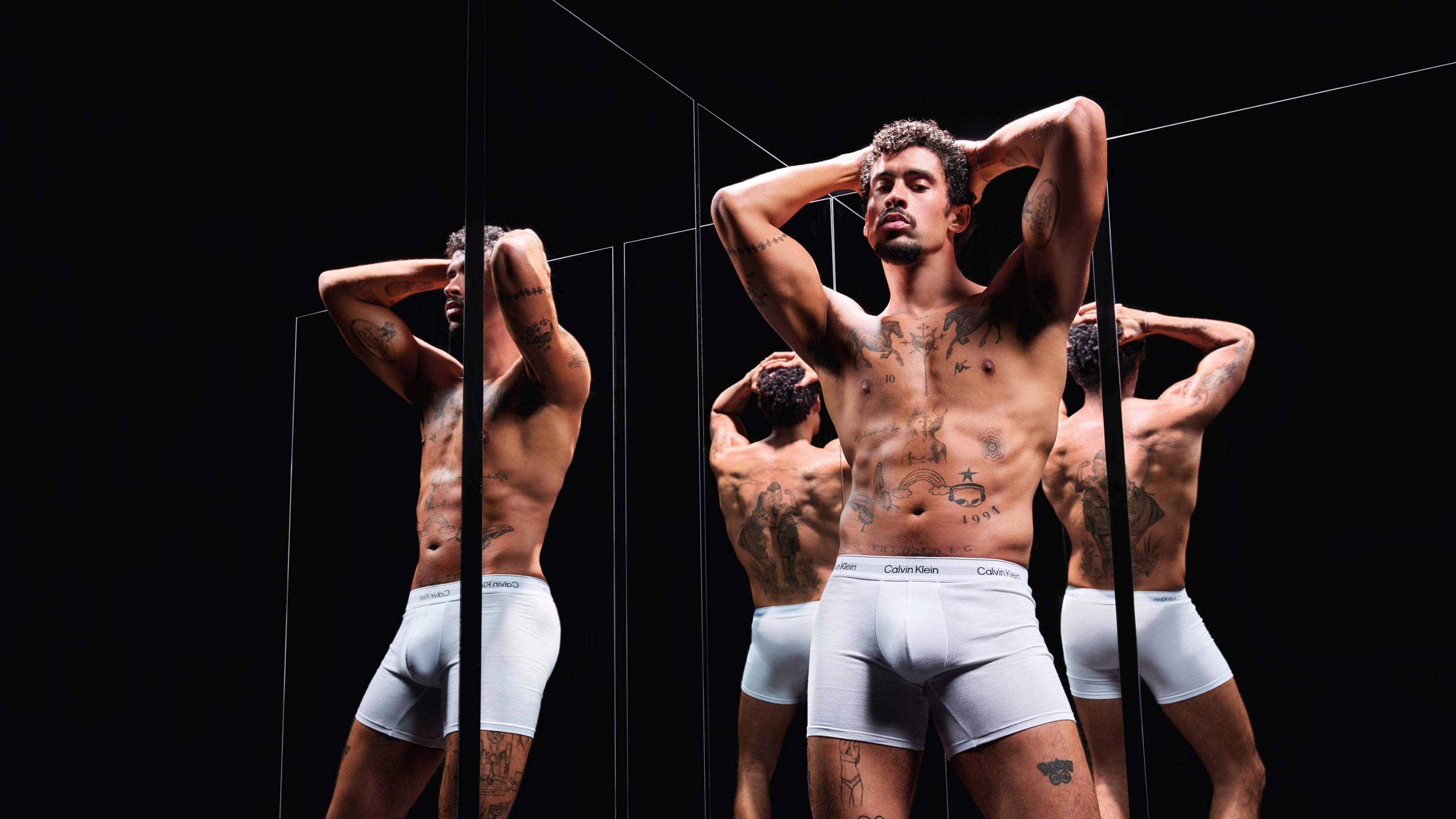 Bad Bunny posing in Calvin Klein Underwear