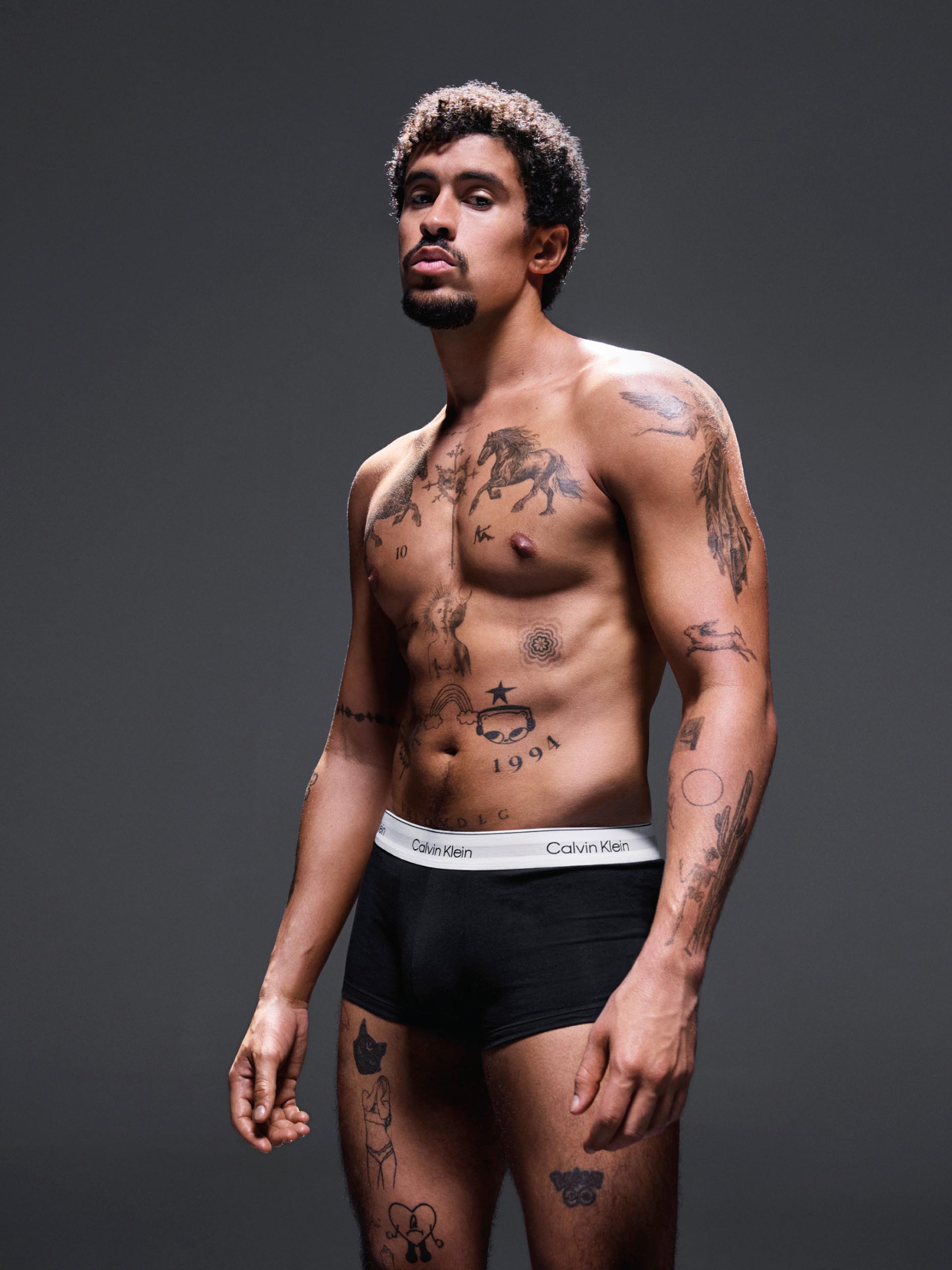 Bad Bunny posing in Calvin Klein Underwear 