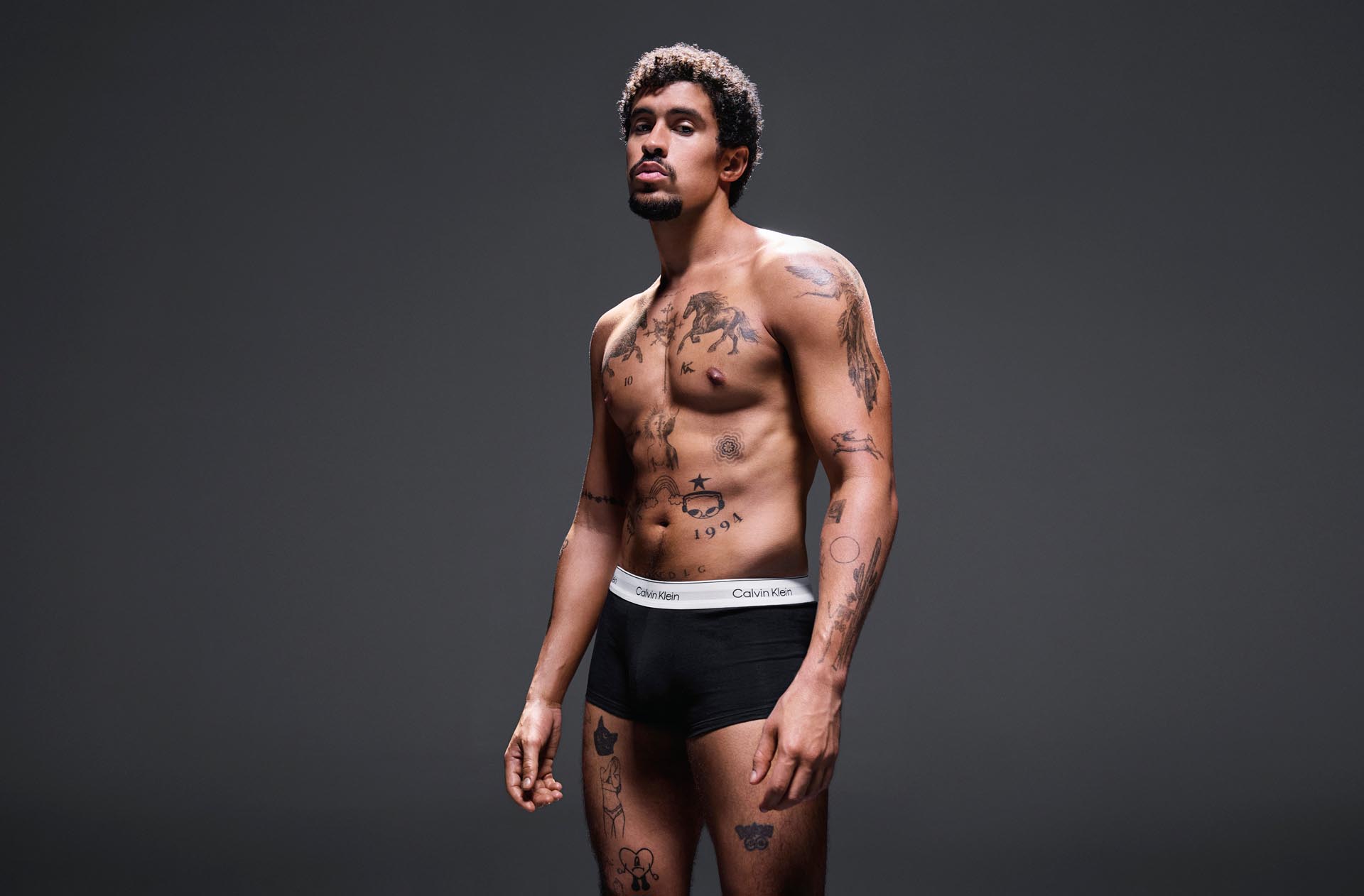 Bad Bunny posing in Calvin Klein Underwear