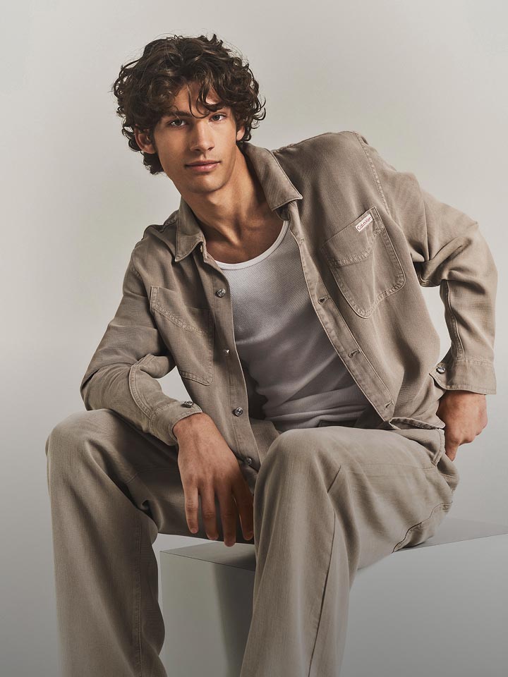 Model posing in a matching denim shirt jacket and jeans