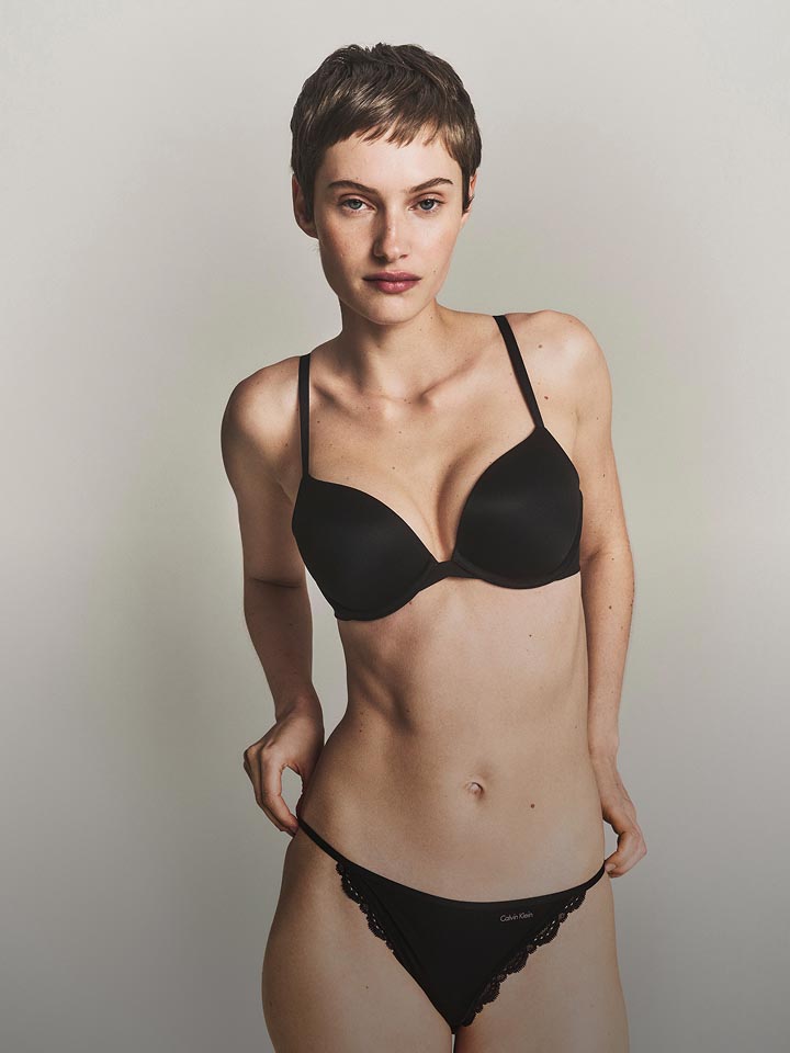 Model wearing a black underwire t-shirt bra and panties.