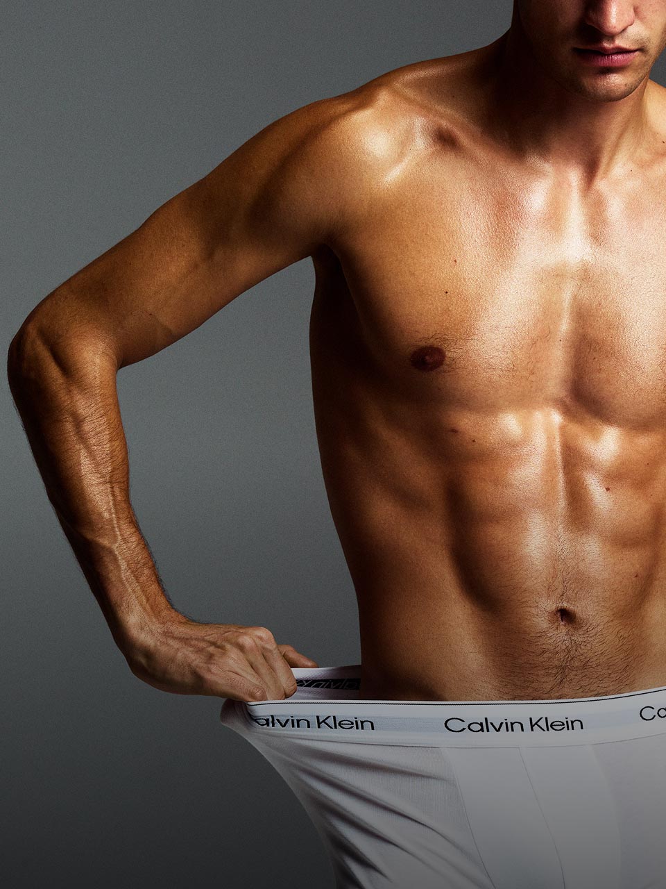 Model posing in black Icon Cotton trunks.
