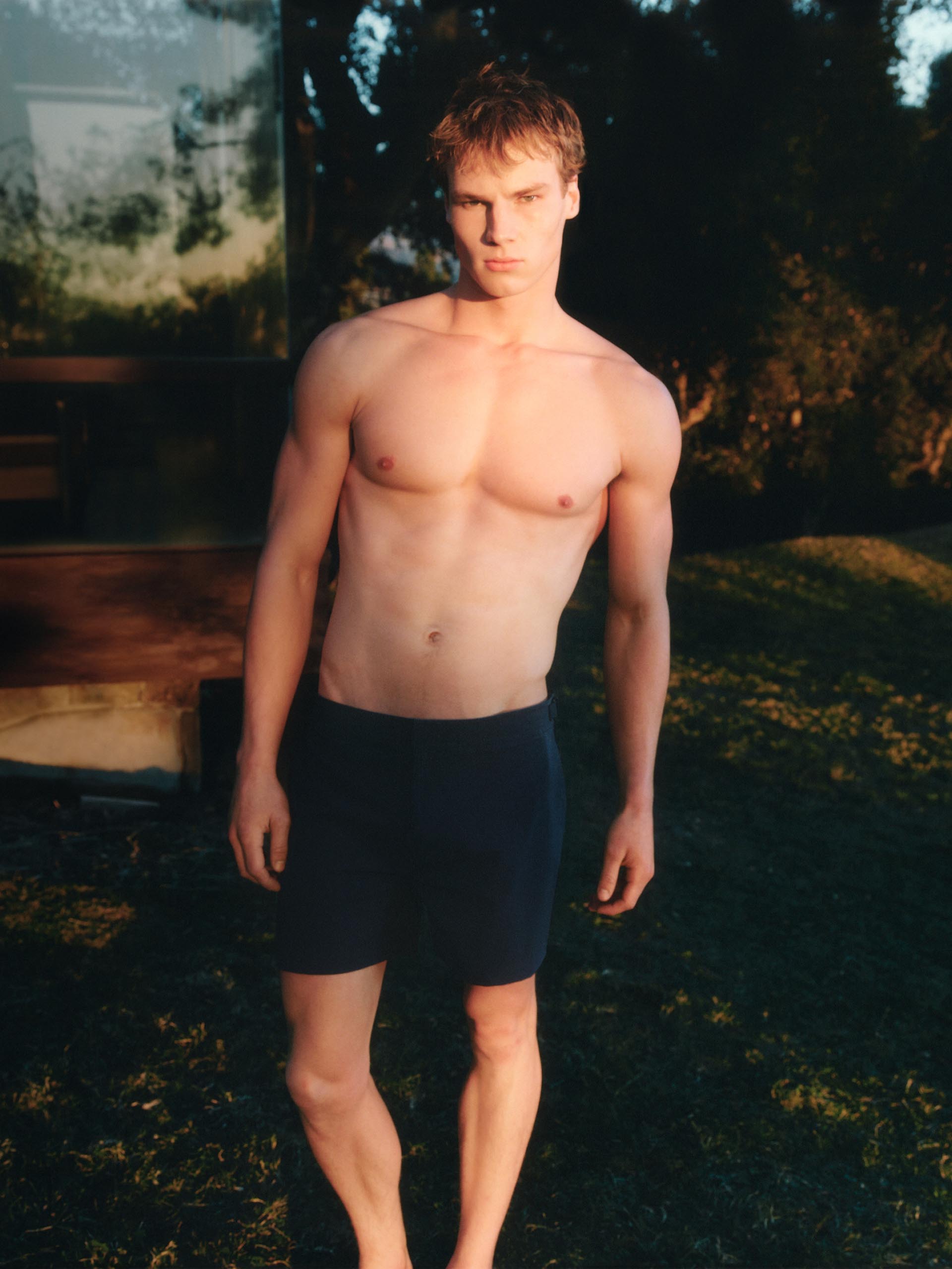 Male and female models posing in Calvin Klein swimwear.
