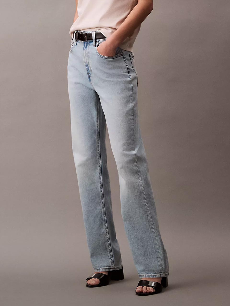 Model wearing head to toe black outfit featuring the high rise straight fit jeans.