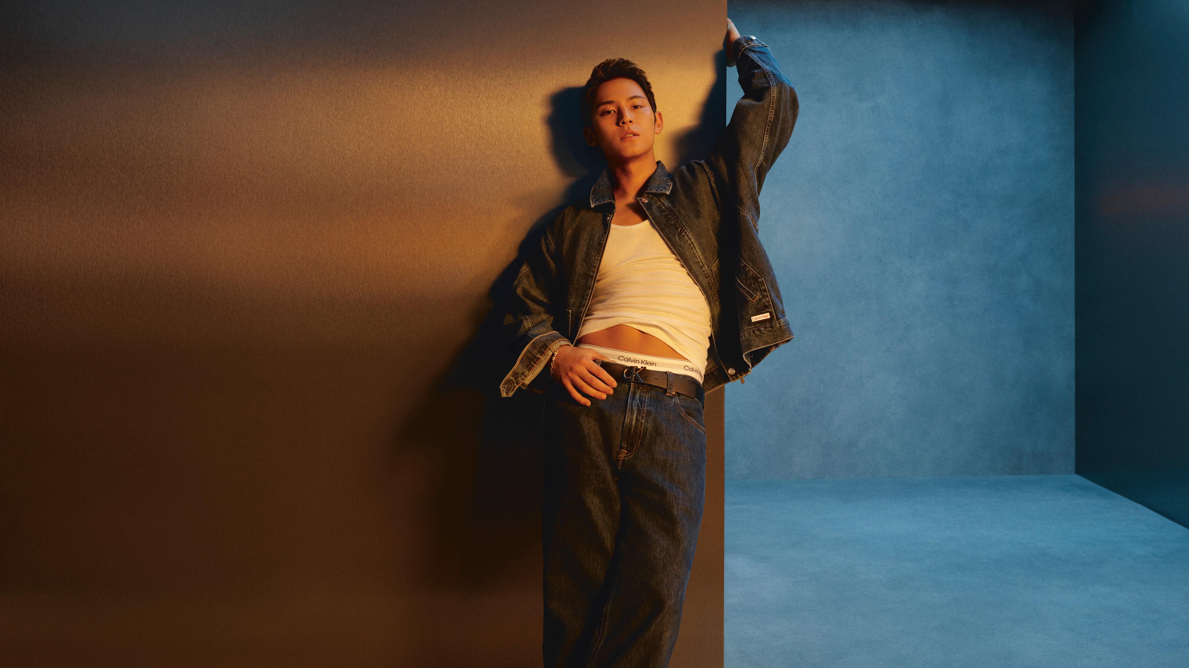 MINGYU is wearing Denim Workwear Jacket and 90s Tapered Jeans.