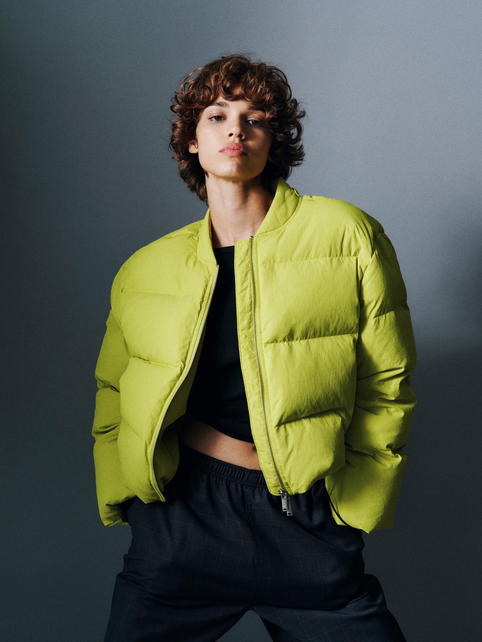 Models posing in Calvin Klein puffer coats