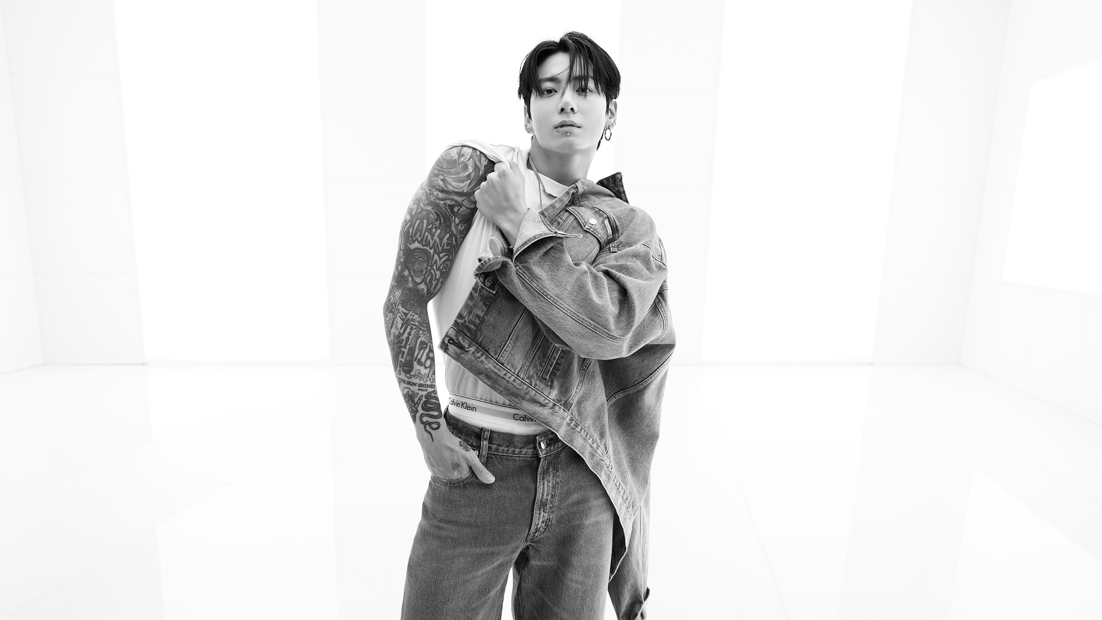 Jung Kook posing in Calvin Klein denim