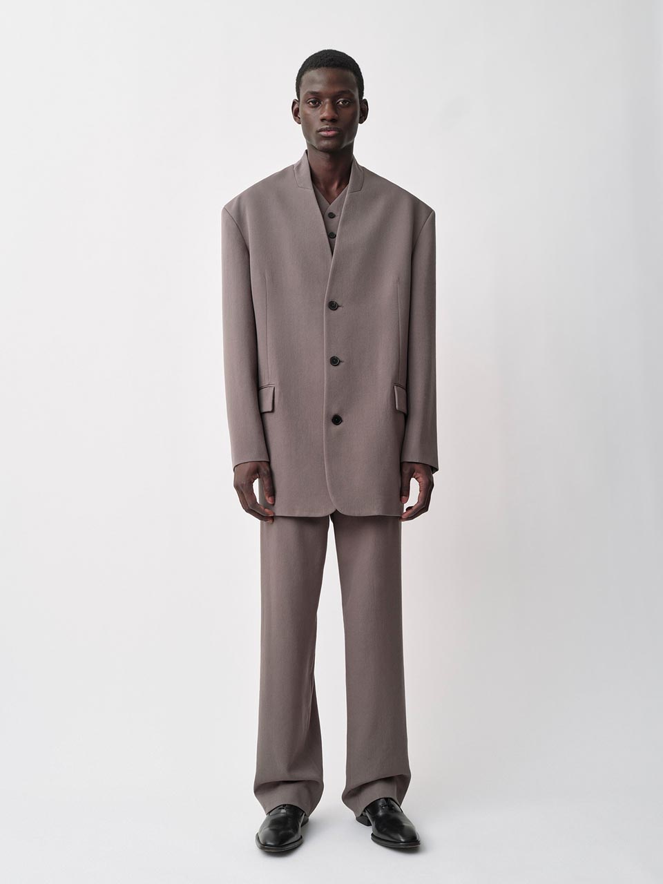 Model posing in a Calvin Klein Collection suit