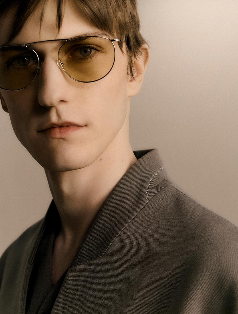 Model posing in Calvin Klein Collection round sunglasses