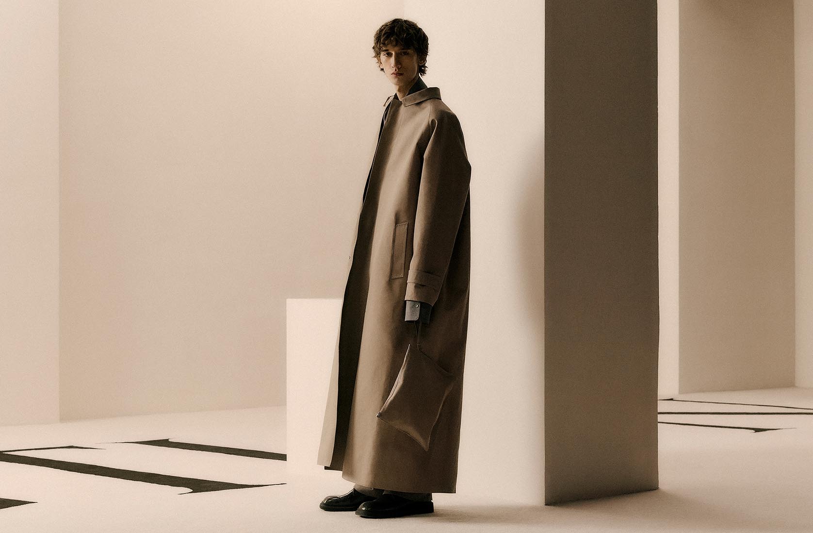 Model wearing a red Calvin Klein Collection evening dress and bag