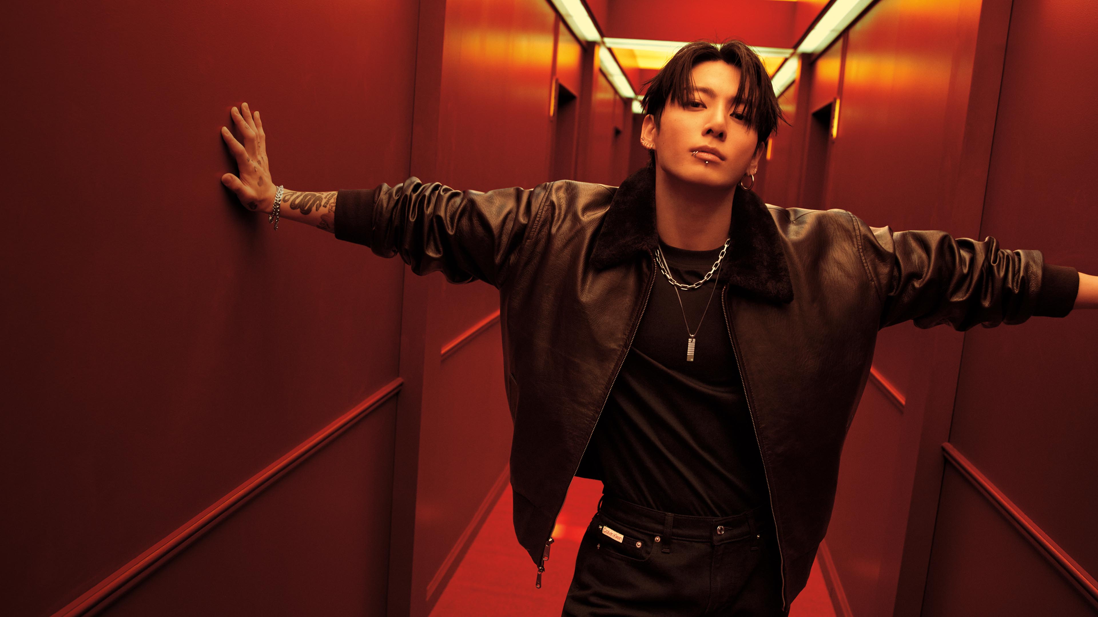 Jung Kook posing in Calvin Klein outerwear