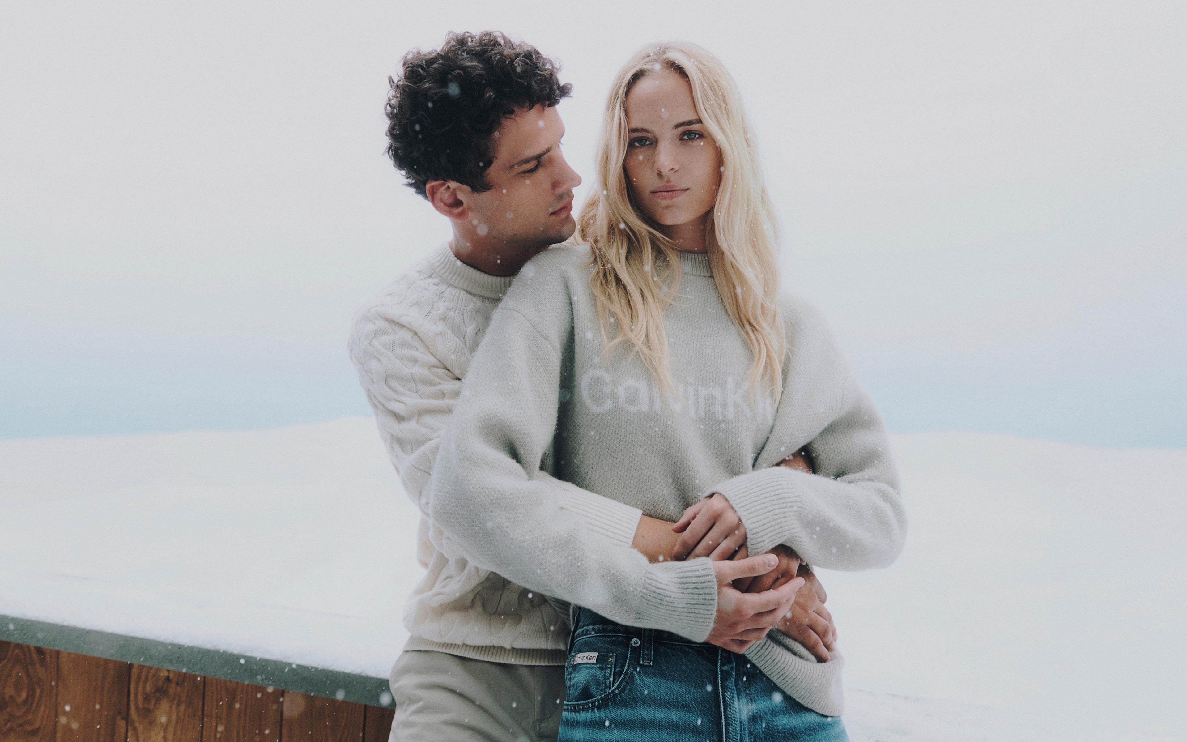 Models posing in Calvin Klein sweaters