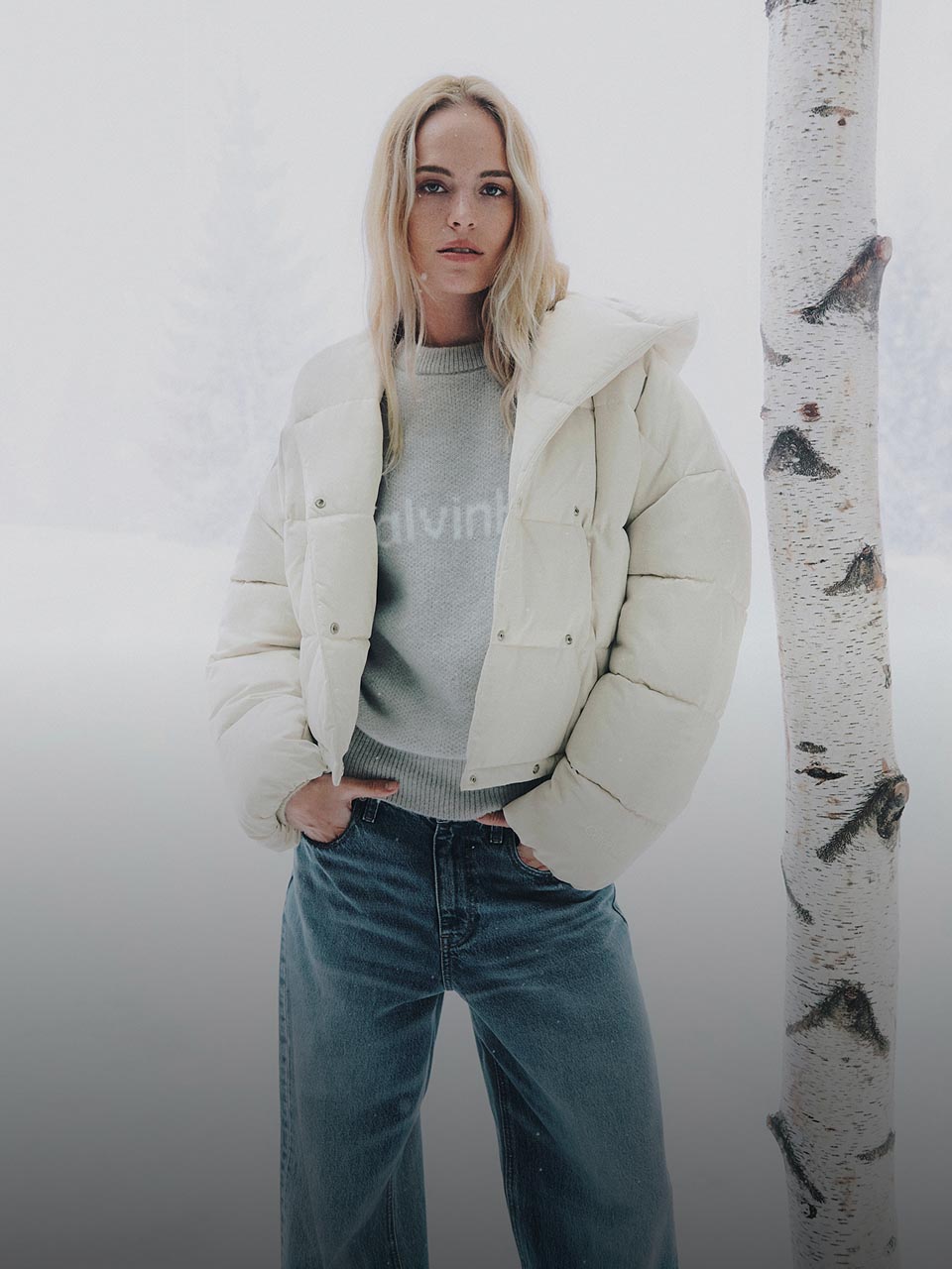Model posing in a white puffer jacket