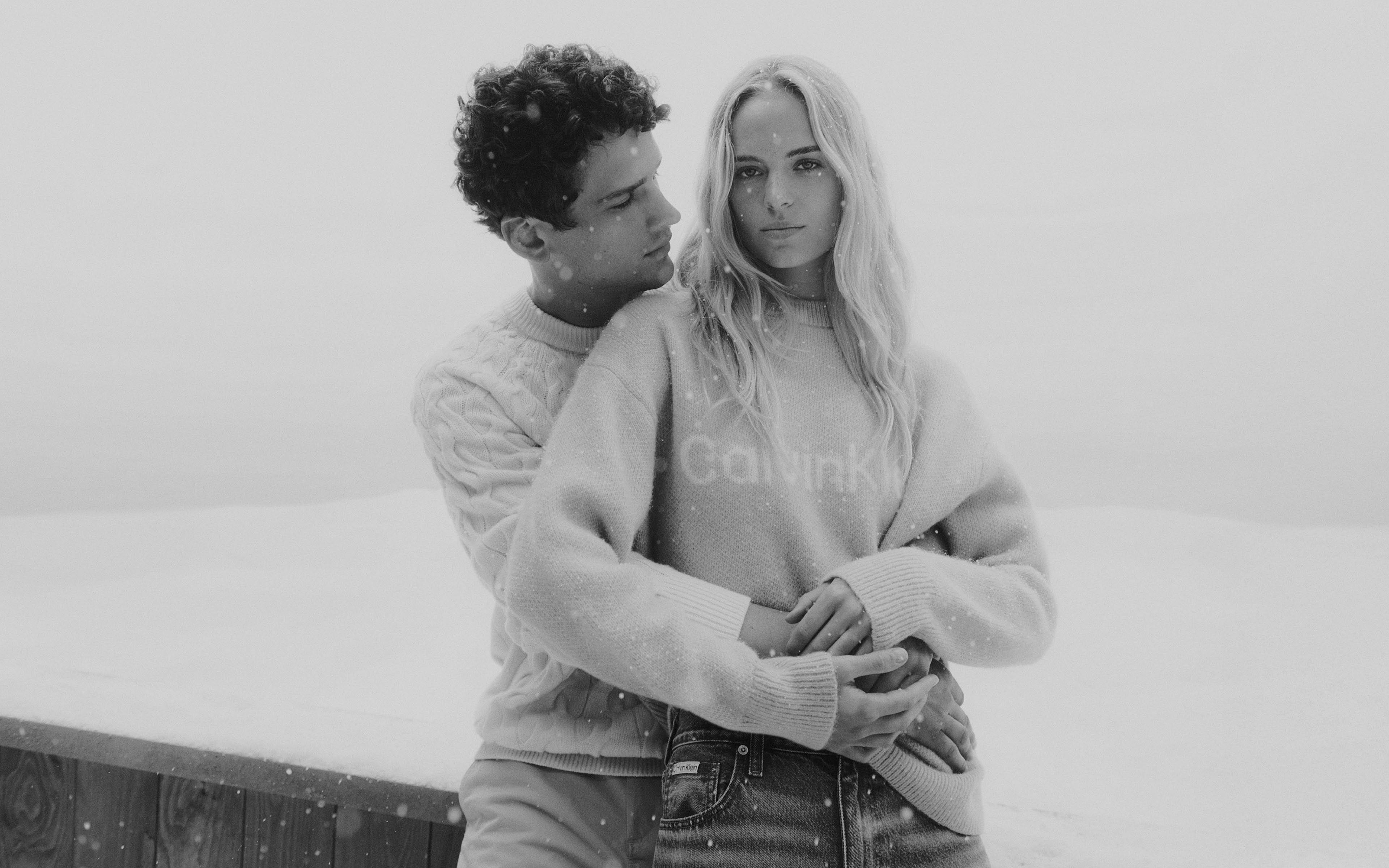 Models posing in Calvin Klein sweaters