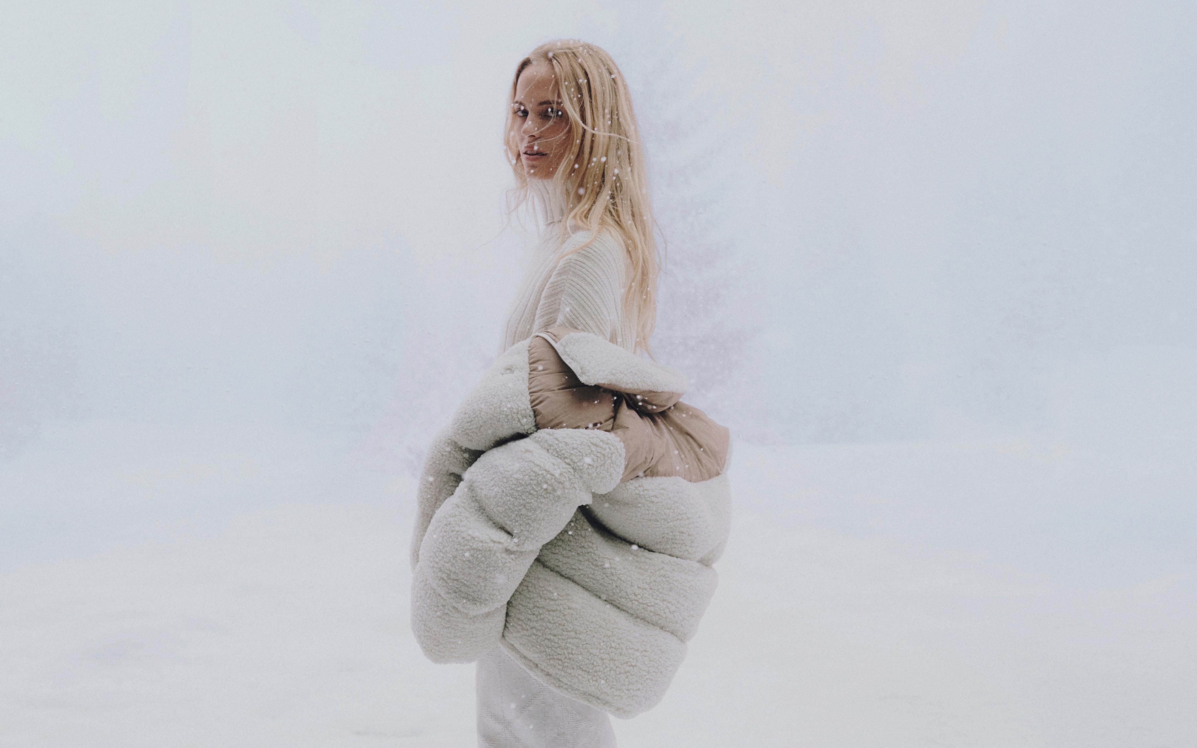 Model posing in a Calvin Klein coat