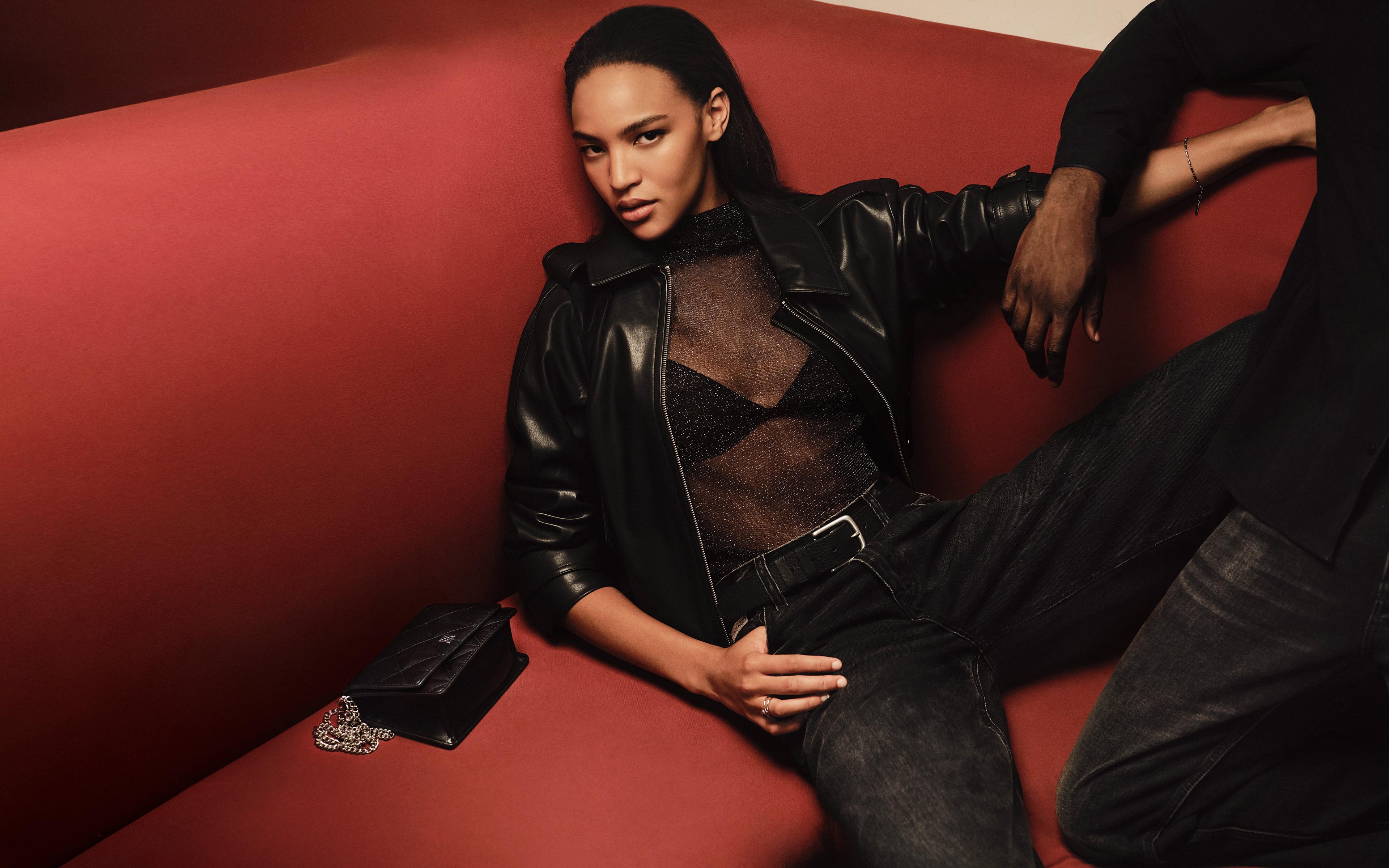 Model posing in a Calvin Klein leather jacket