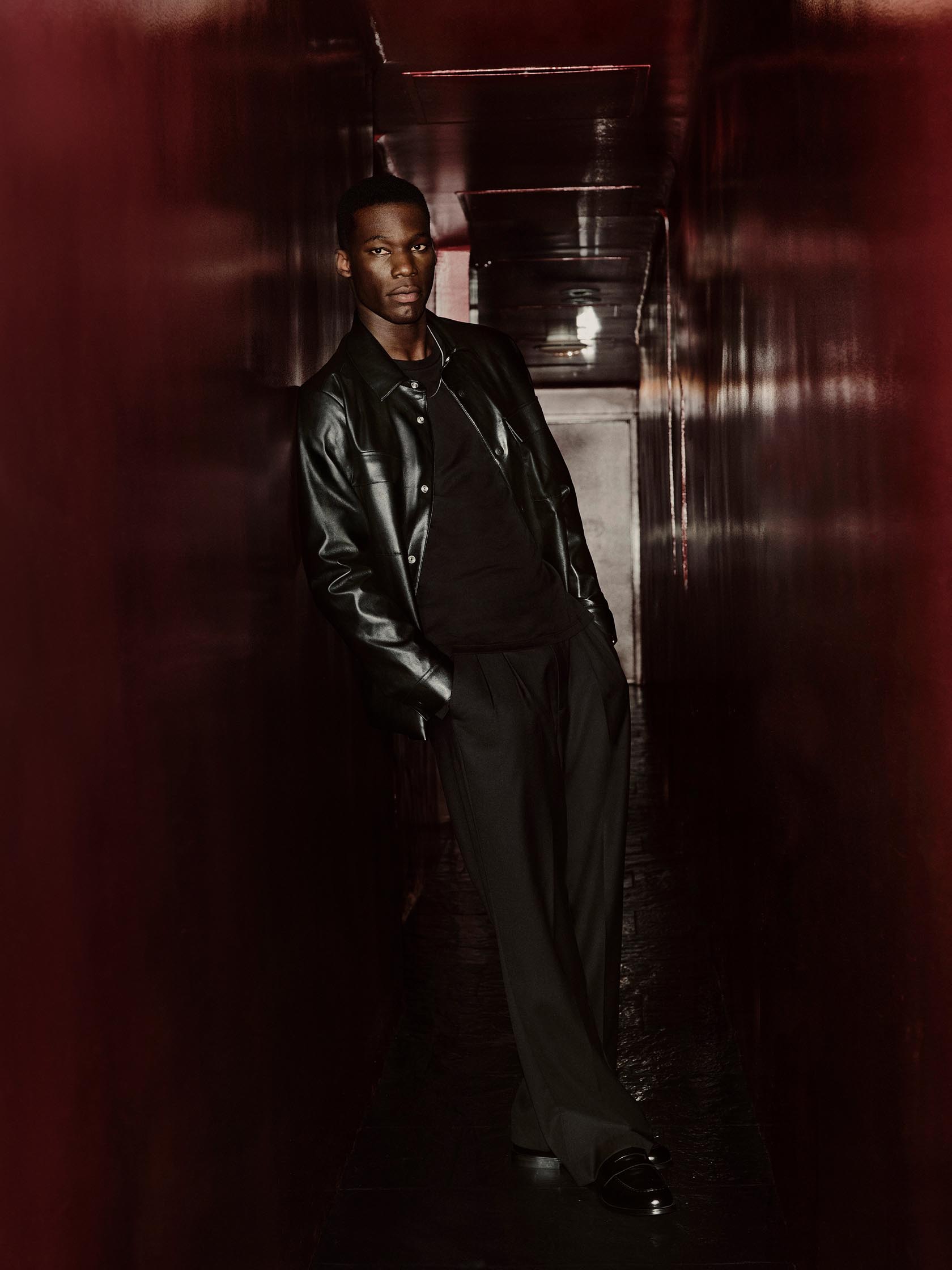 Model posing in a Calvin Klein leather jacket