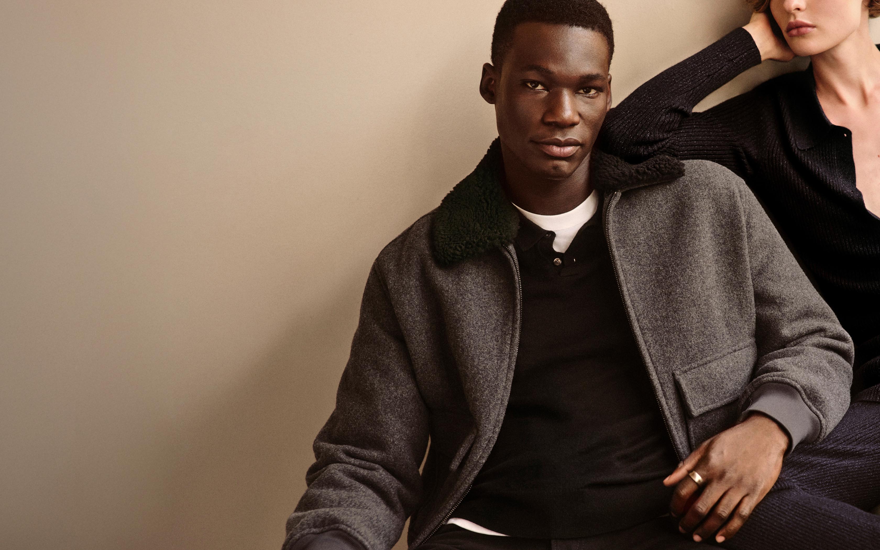 Models posing in Calvin Klein winter apparel