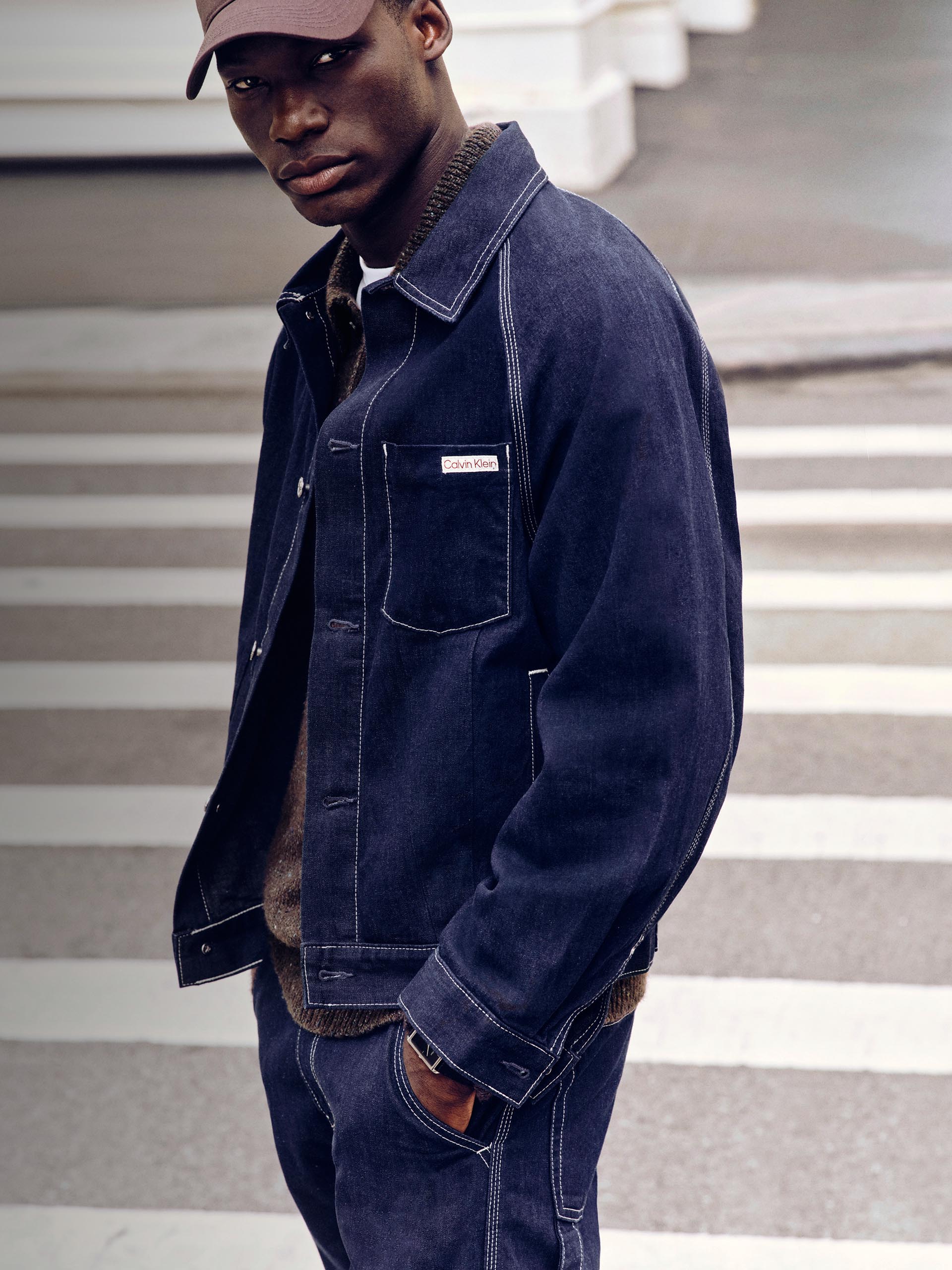 Models posing in dark blue Calvin Klein denim