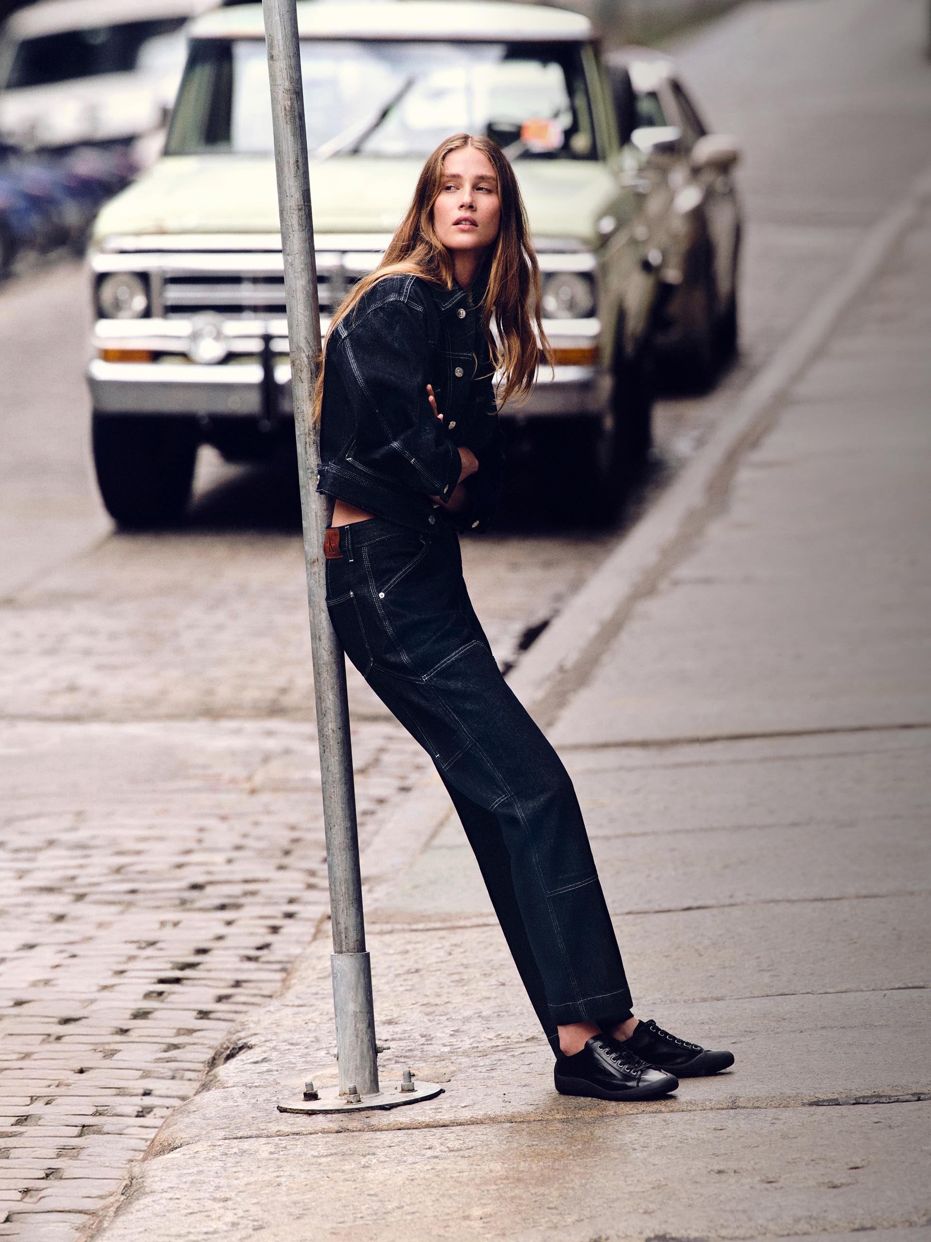 Models posing in dark blue Calvin Klein denim