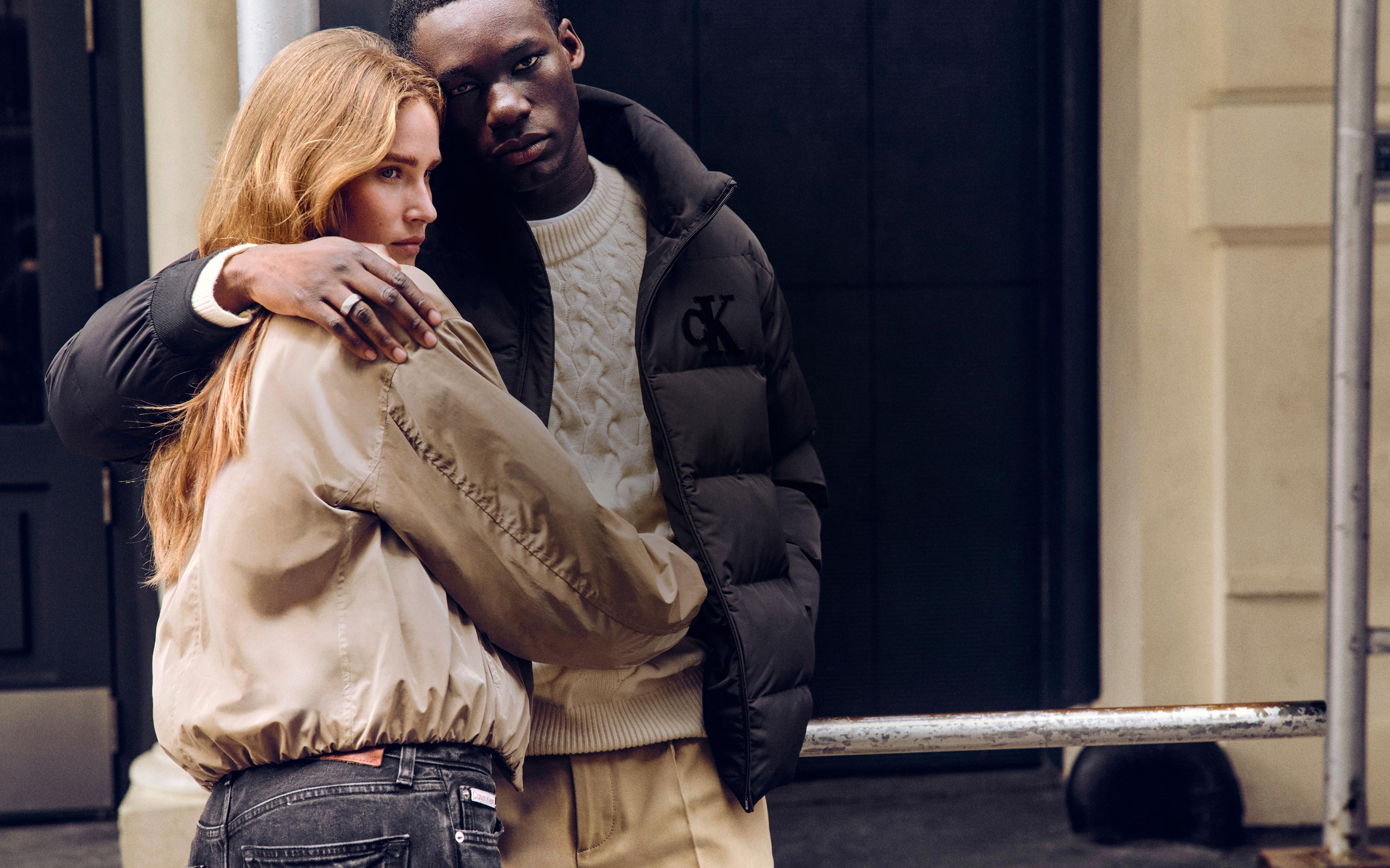 Models posing in Calvin Klein outerwear