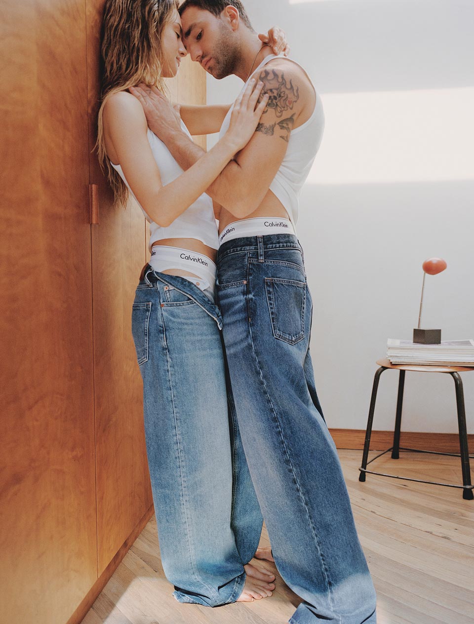 Jackson White posing in Calvin Klein denim