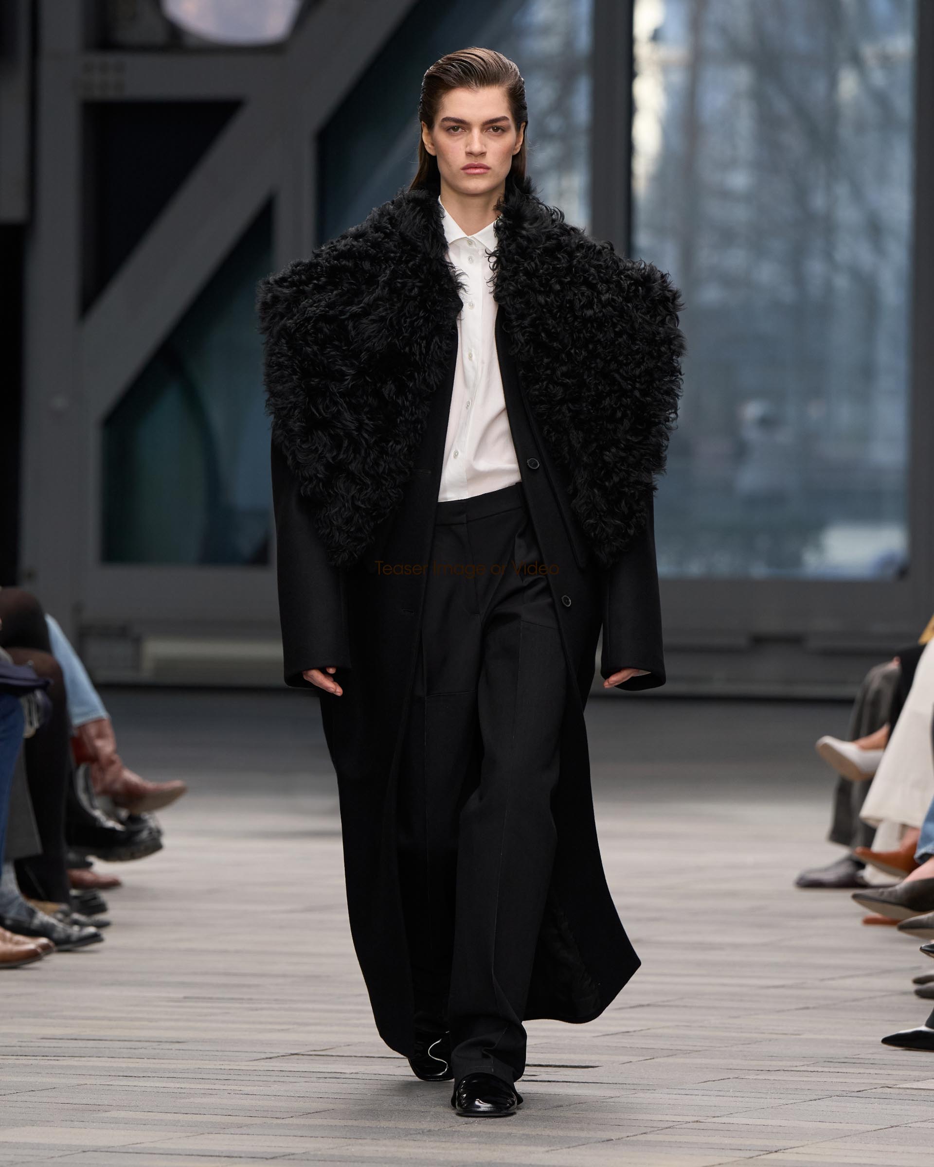 Models posing in Calvin Klein Collection apparel