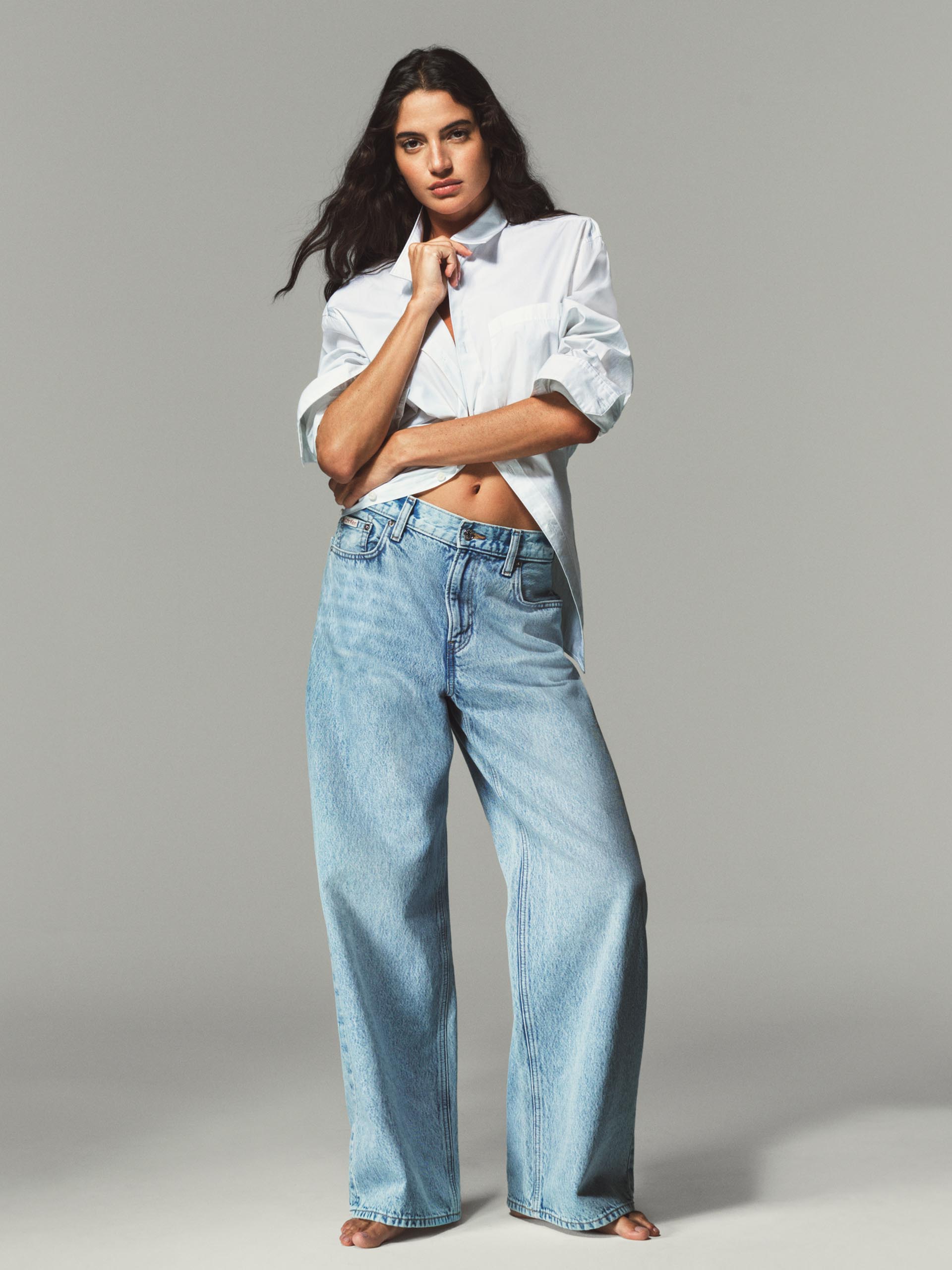 Model posing in baggy denim