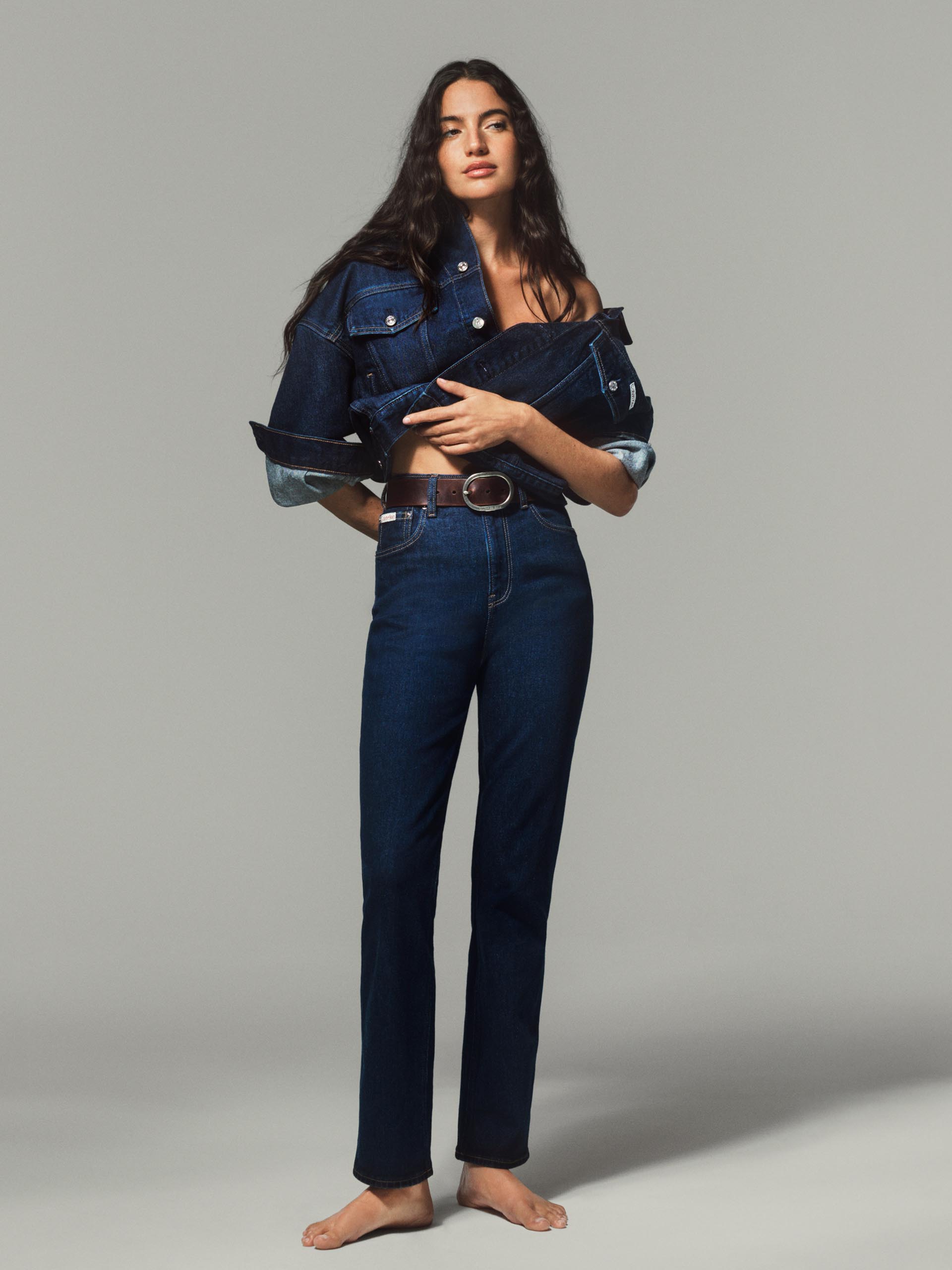 Model posing in slim denim