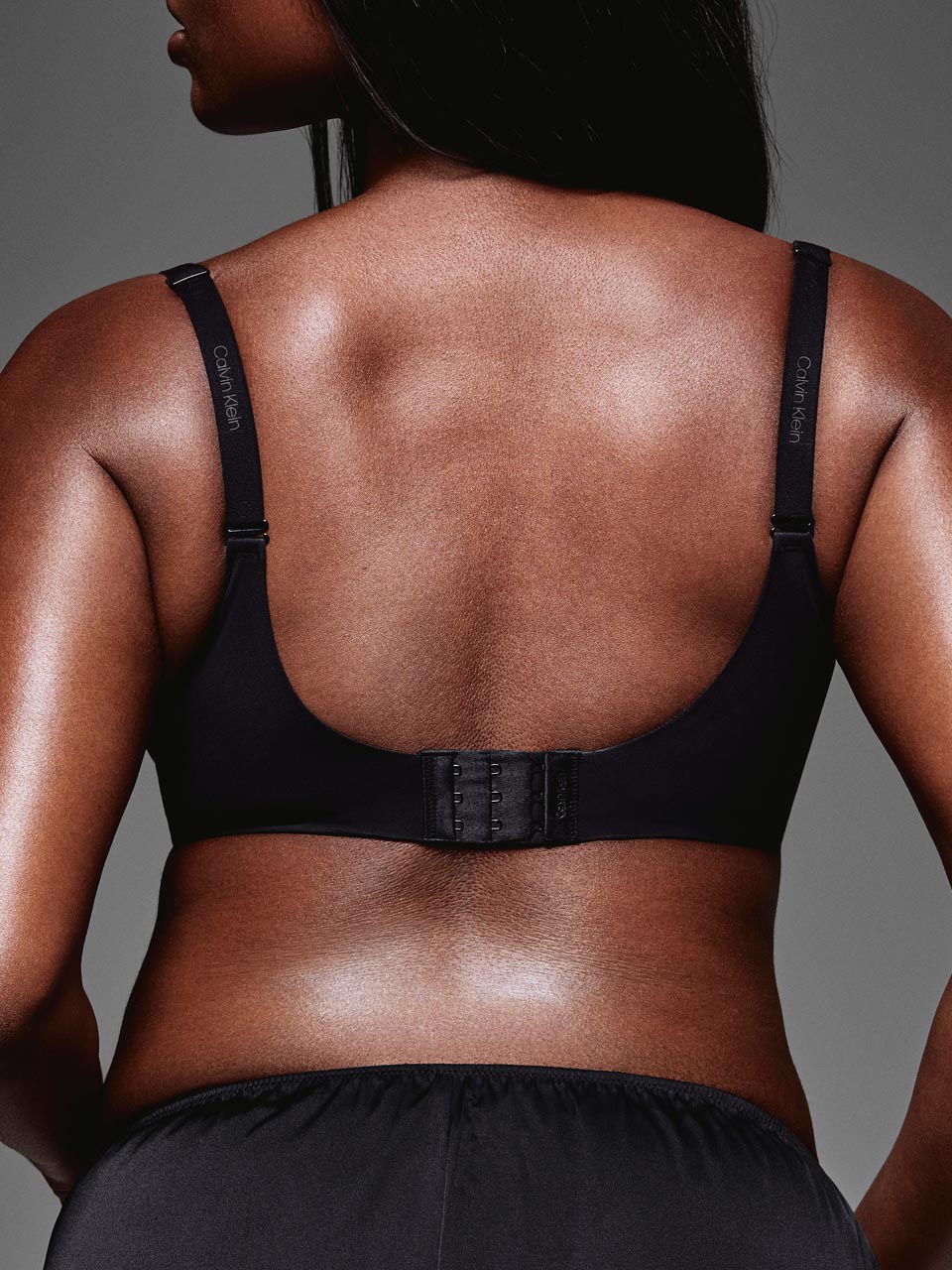 Model posing in a full coverage Calvin Klein bra