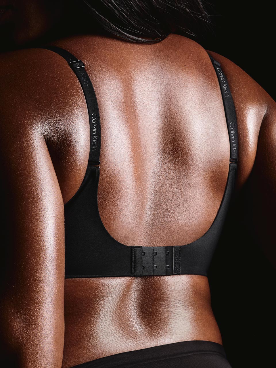 Model posing in a push up Calvin Klein bra