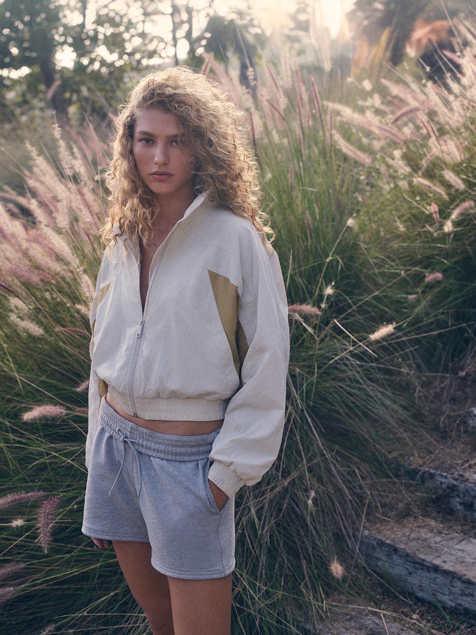 Model posing in a navy blue t-shirt dress
