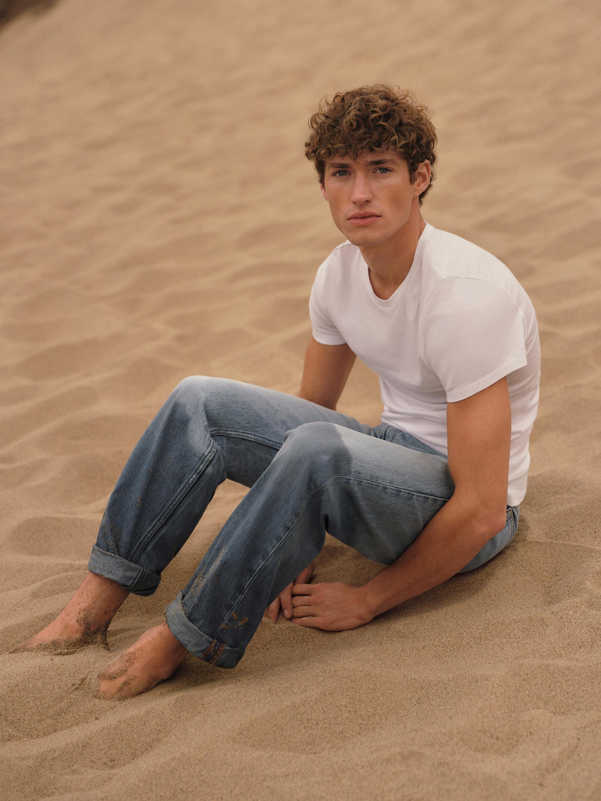 Models posing in Calvin Klein spring tees