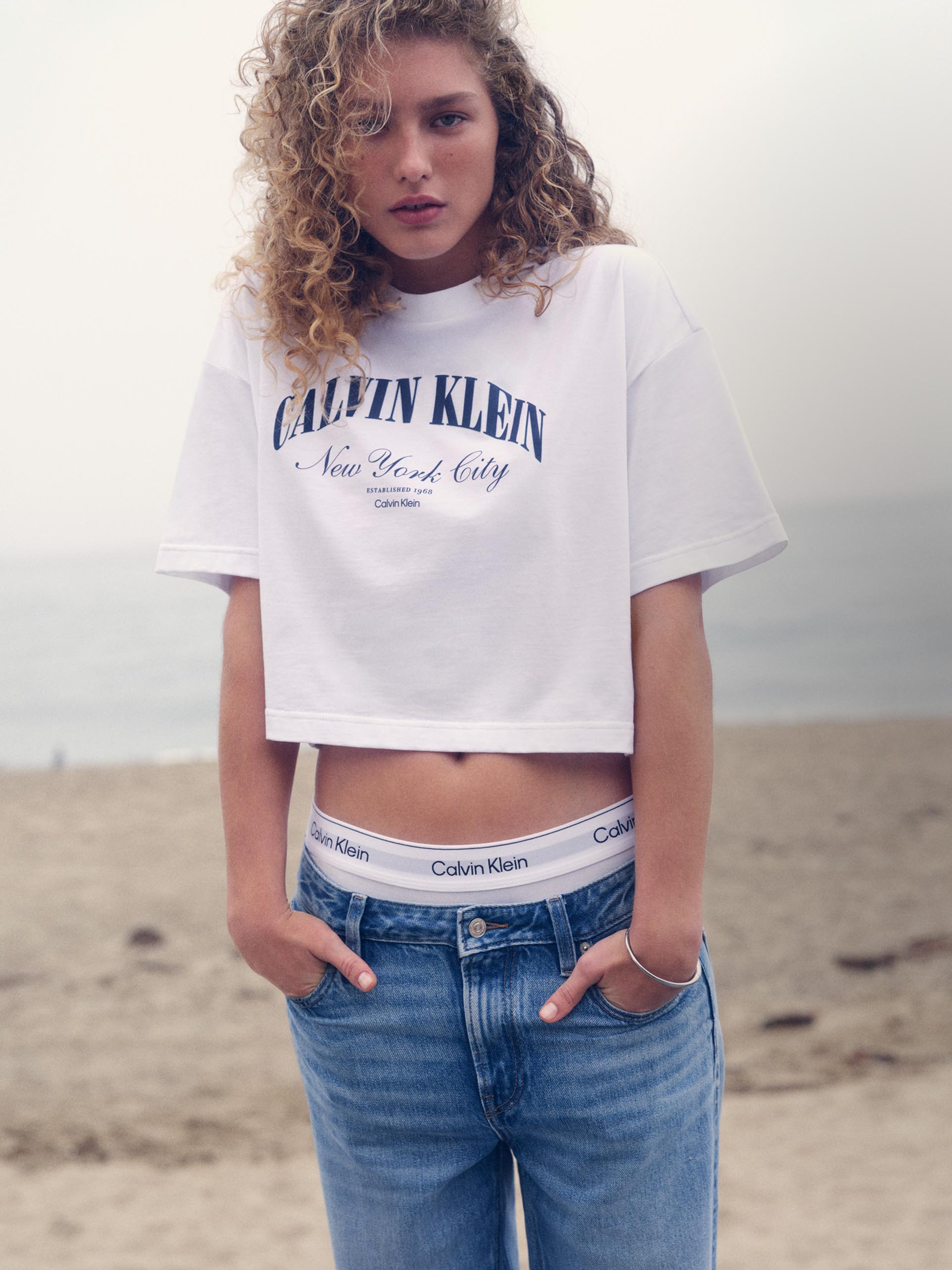 Models posing in Calvin Klein spring tees