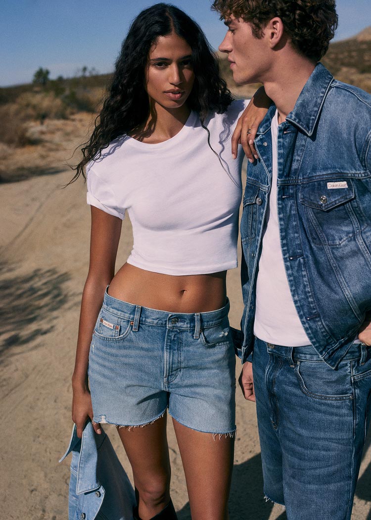 Models posing in Calvin Klein jeans